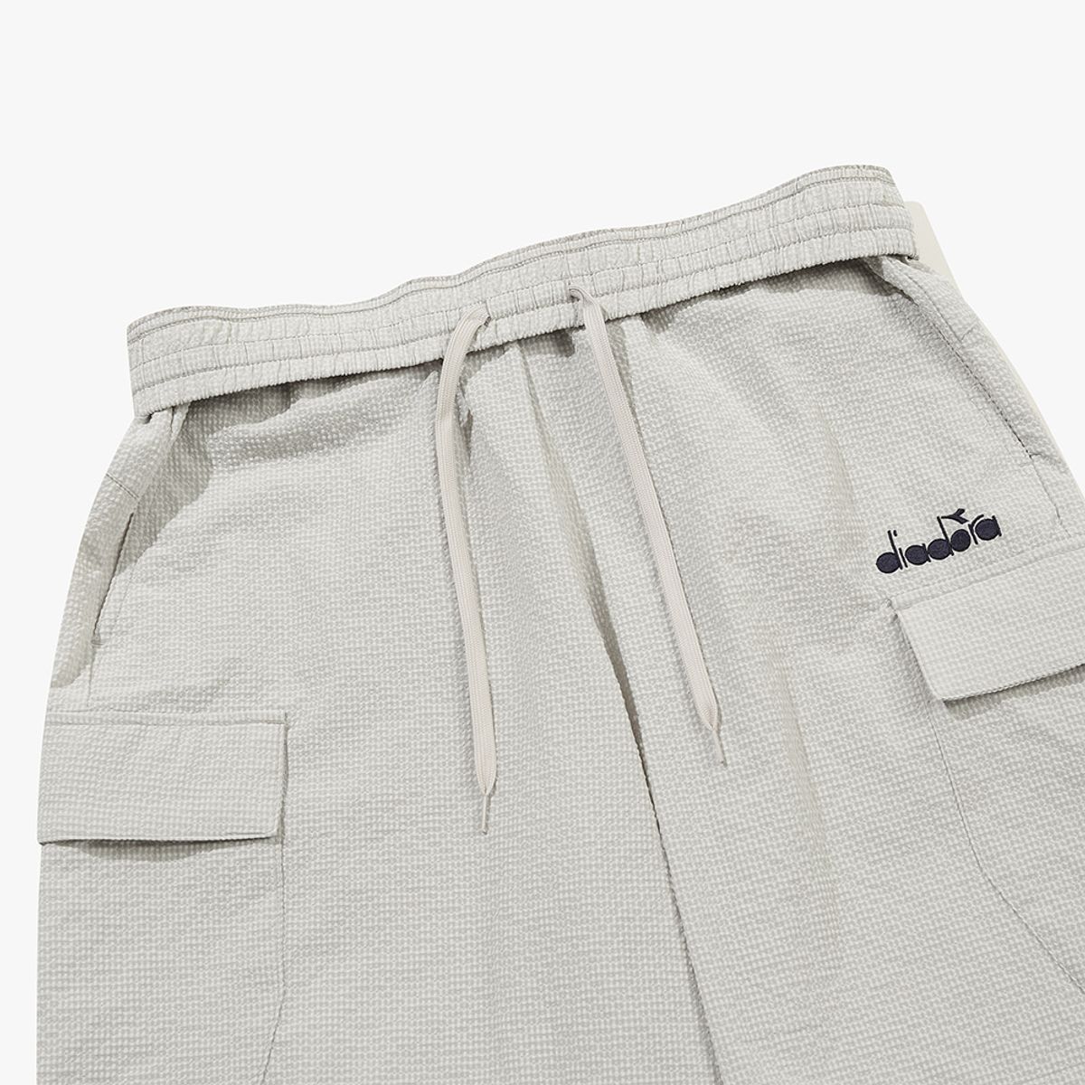 디아도라(diadora) 에어서커 카고 하프팬츠 BEIGE