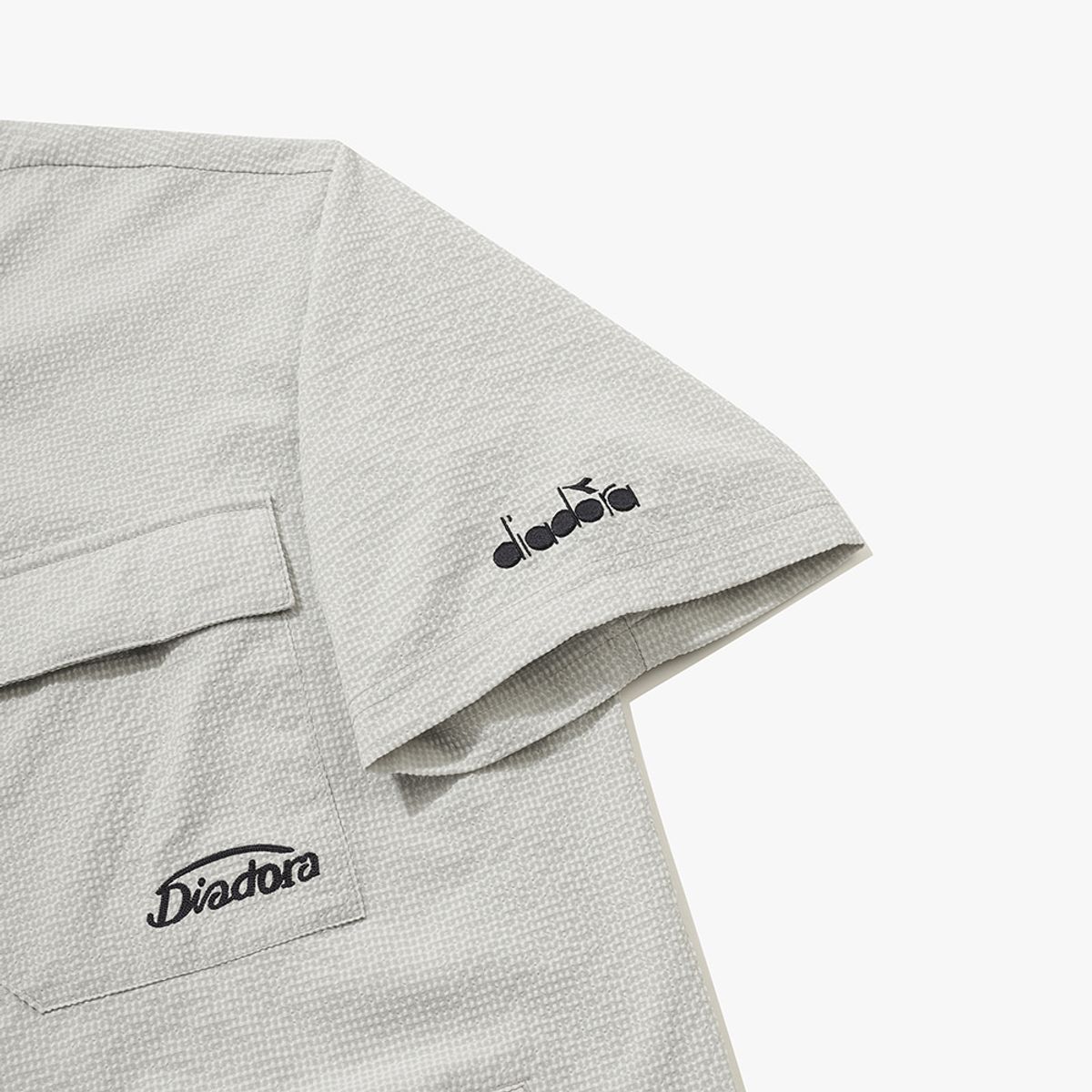 디아도라(diadora) 에어서커 반팔 아노락 BEIGE
