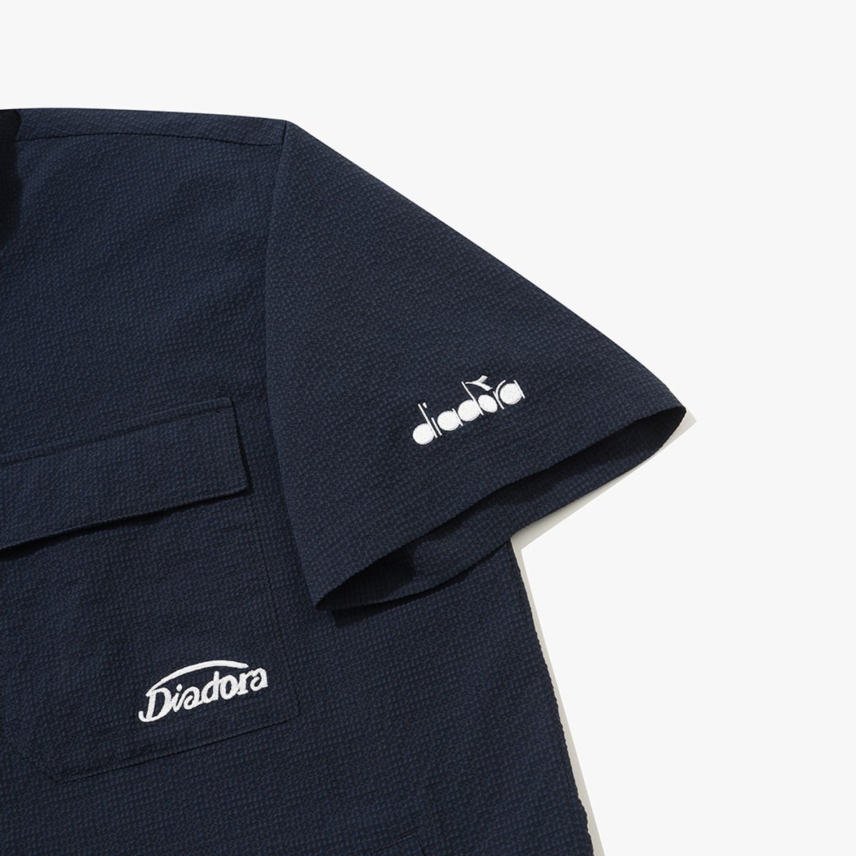 디아도라(diadora) 에어서커 반팔 아노락 NAVY