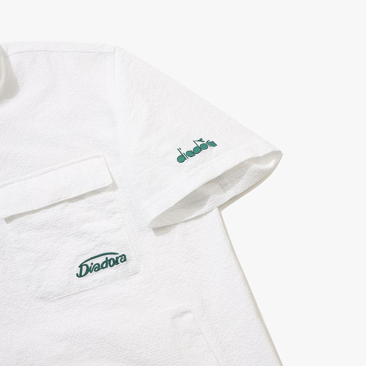 디아도라(diadora) 에어서커 반팔 아노락 OFF WHITE