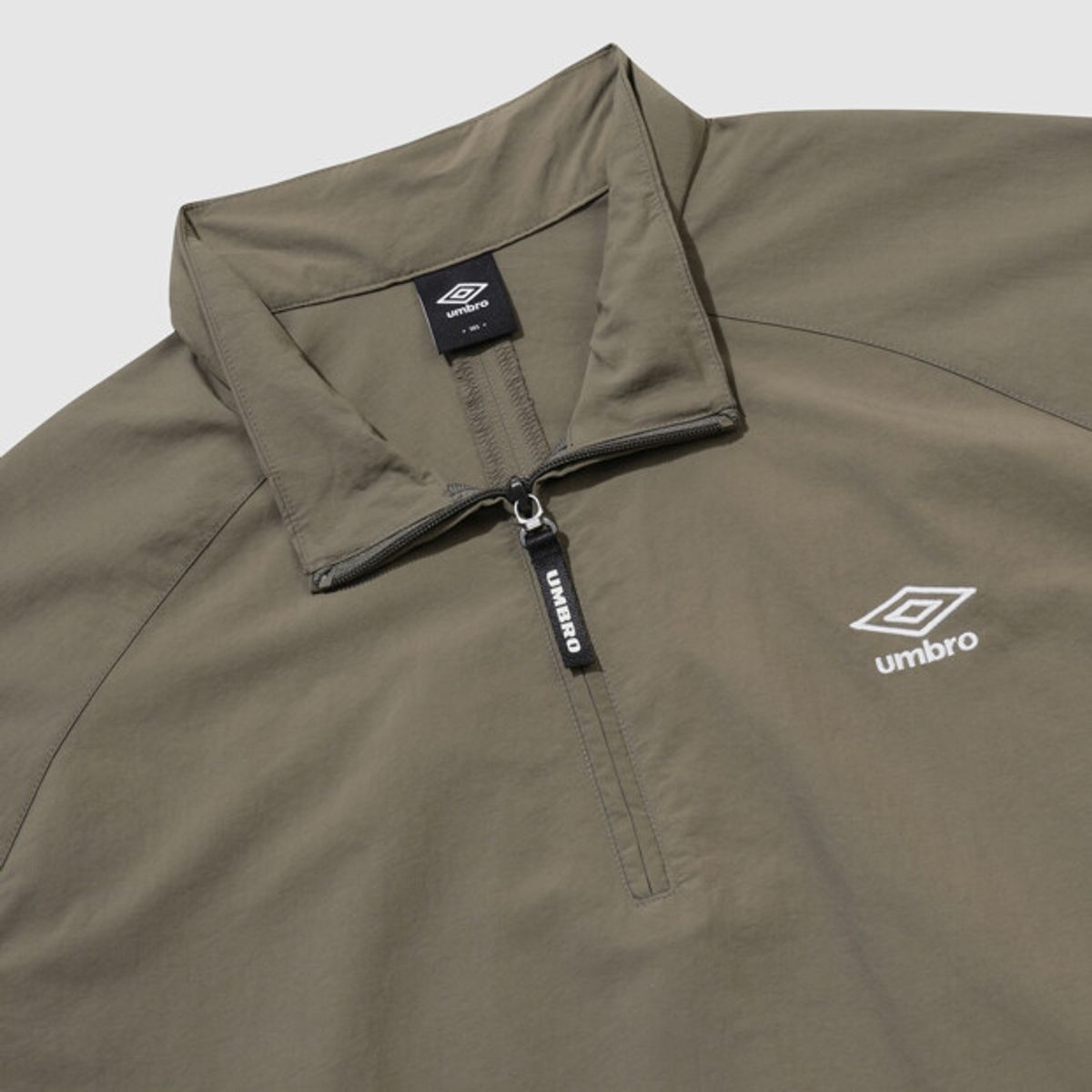 엄브로(UMBRO) 클래식 반팔 스탠넥 아노락 브라운 UR124CWT31