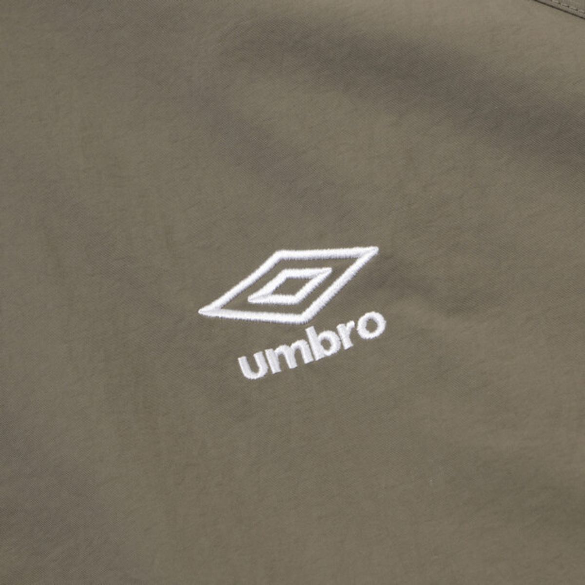 엄브로(UMBRO) 클래식 반팔 스탠넥 아노락 브라운 UR124CWT31