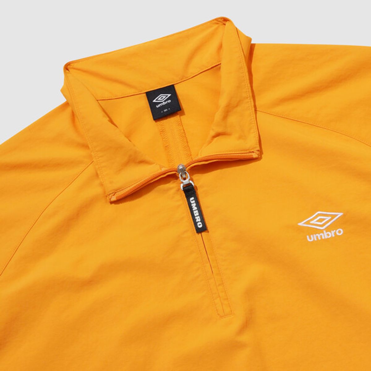 엄브로(UMBRO) 클래식 반팔 스탠넥 아노락 오렌지 UR124CWT31