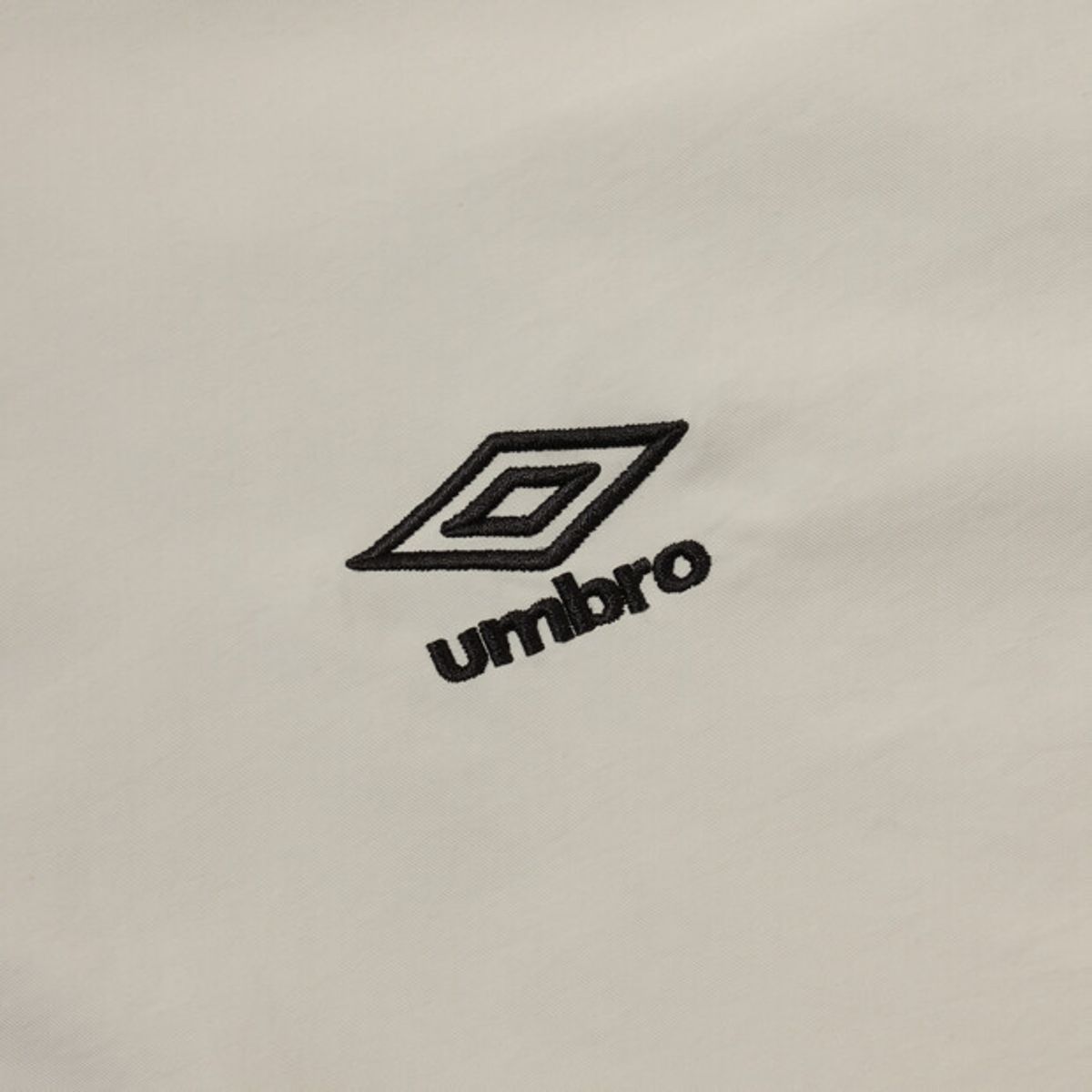 엄브로(UMBRO) 클래식 반팔 스탠넥 아노락 베이지 UR124CWT31