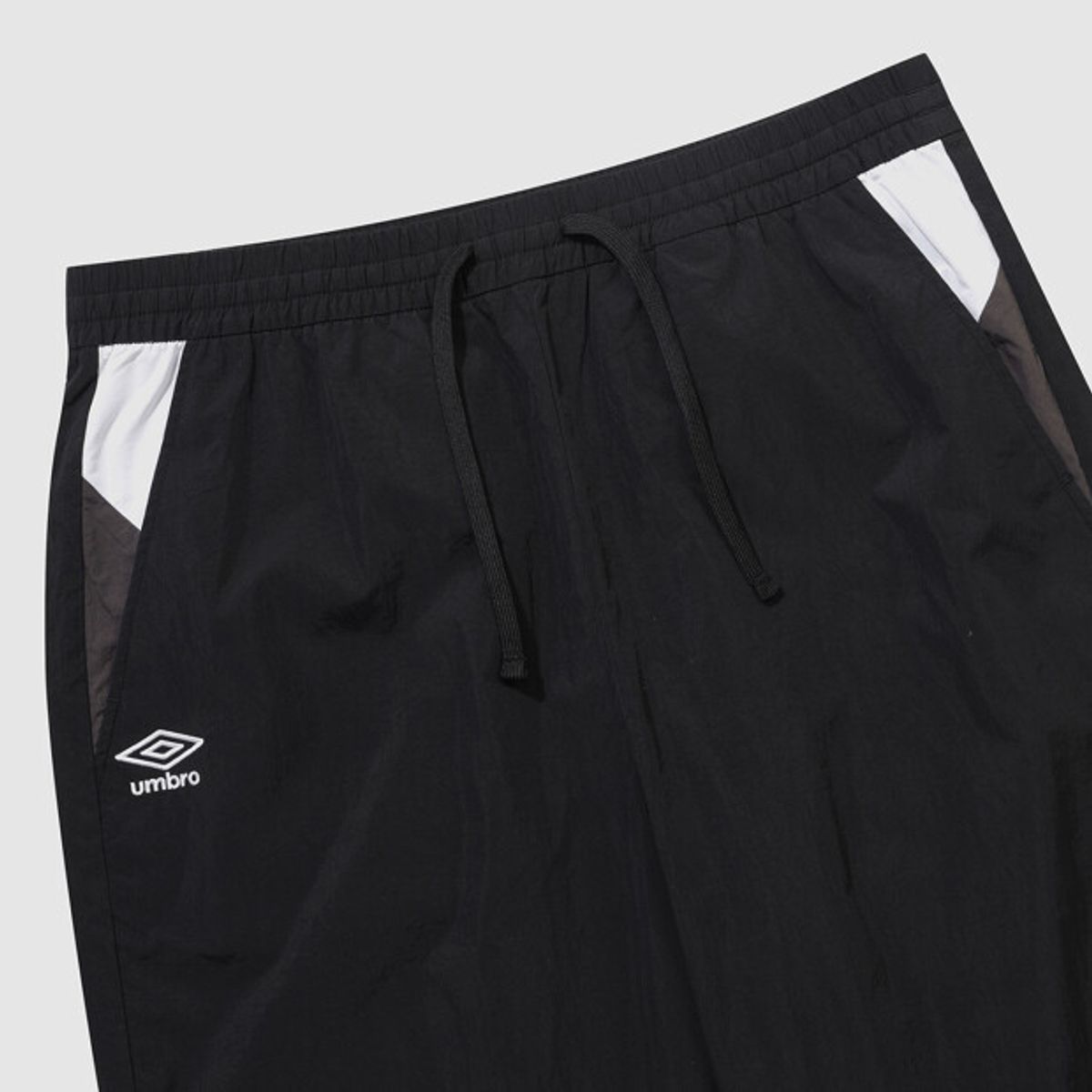 엄브로(UMBRO) 팝러쉬 컬러블럭 조거 팬츠 블랙 UR121CPT32