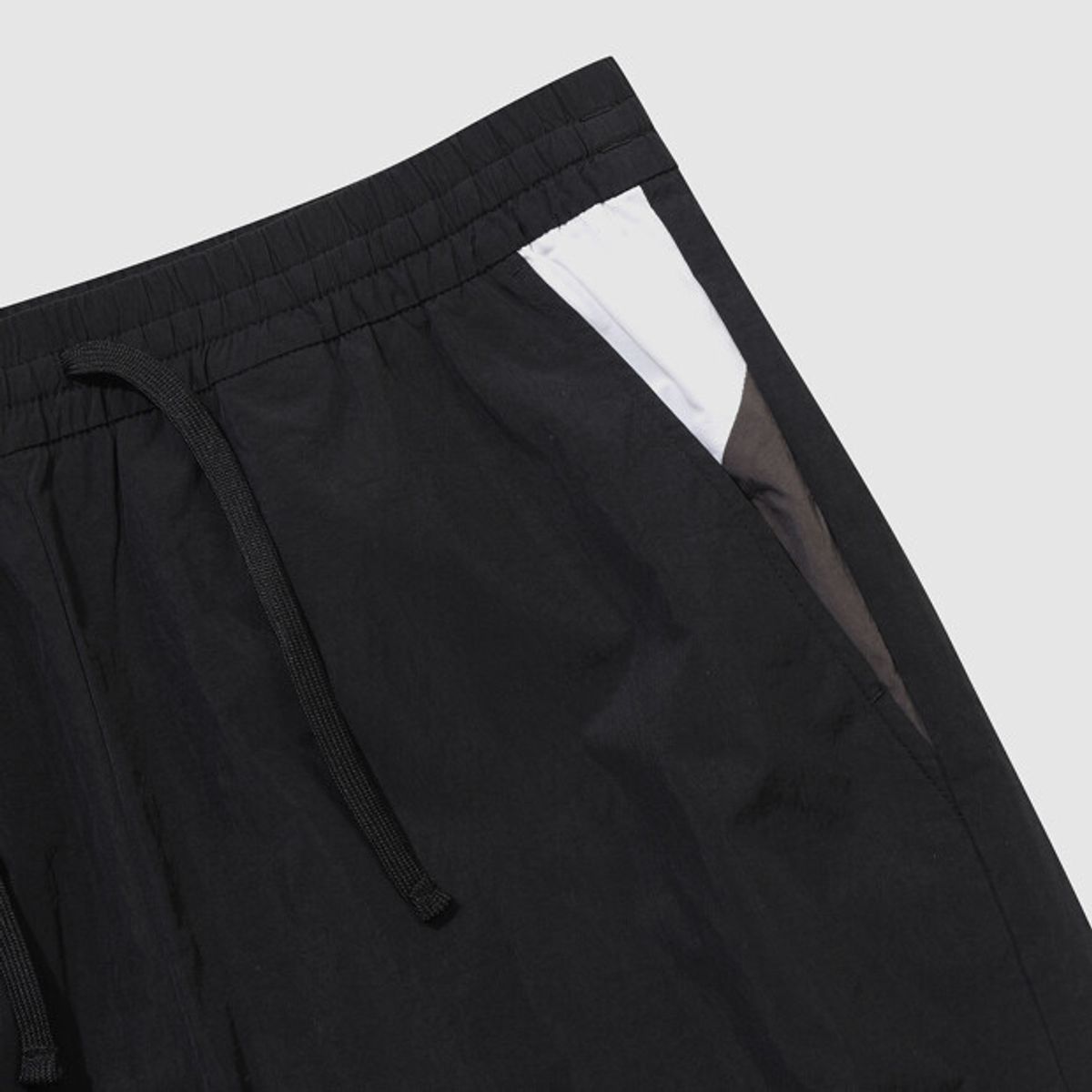 엄브로(UMBRO) 팝러쉬 컬러블럭 조거 팬츠 블랙 UR121CPT32