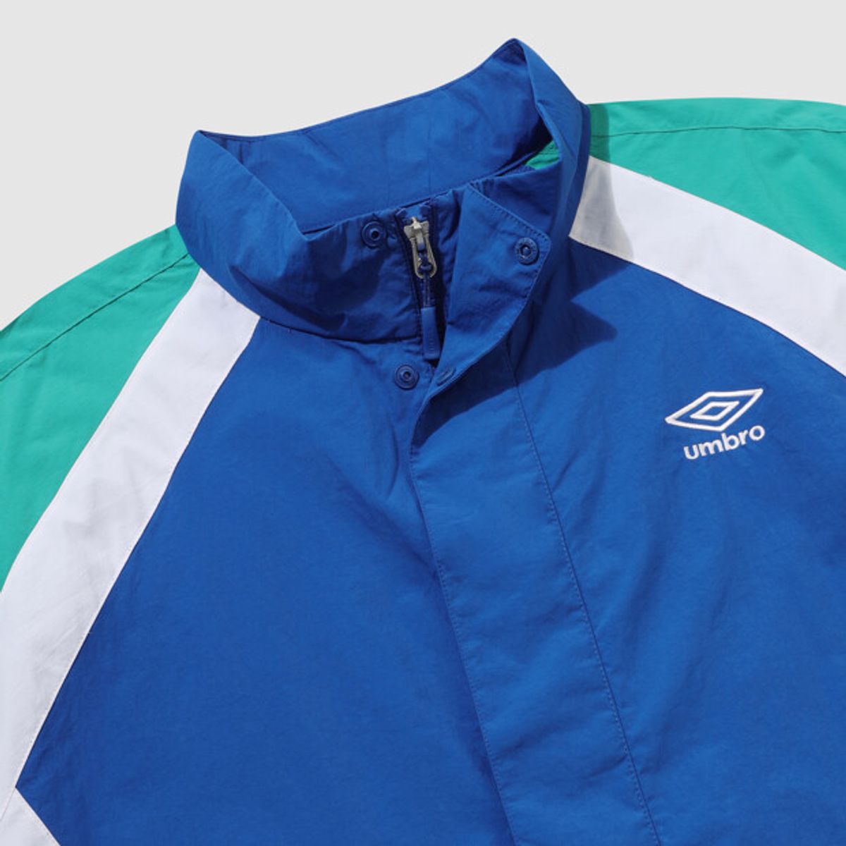 엄브로(UMBRO) 팝러쉬 컬러블럭 스탠넥 아노락 블루 UR123CWT34