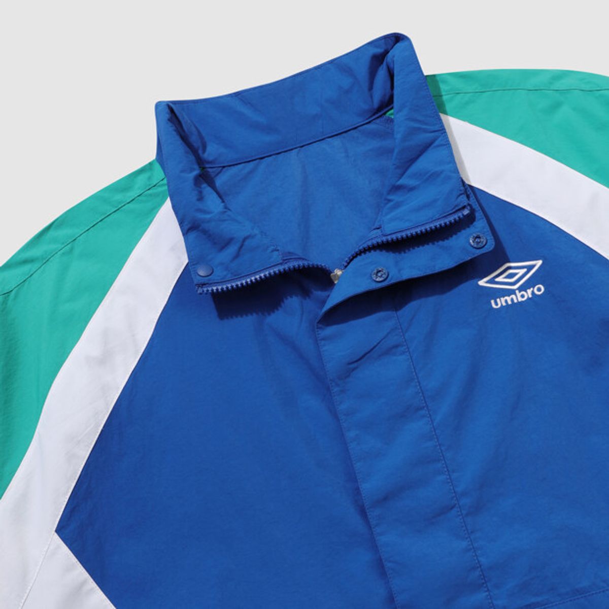 엄브로(UMBRO) 팝러쉬 컬러블럭 스탠넥 아노락 블루 UR123CWT34