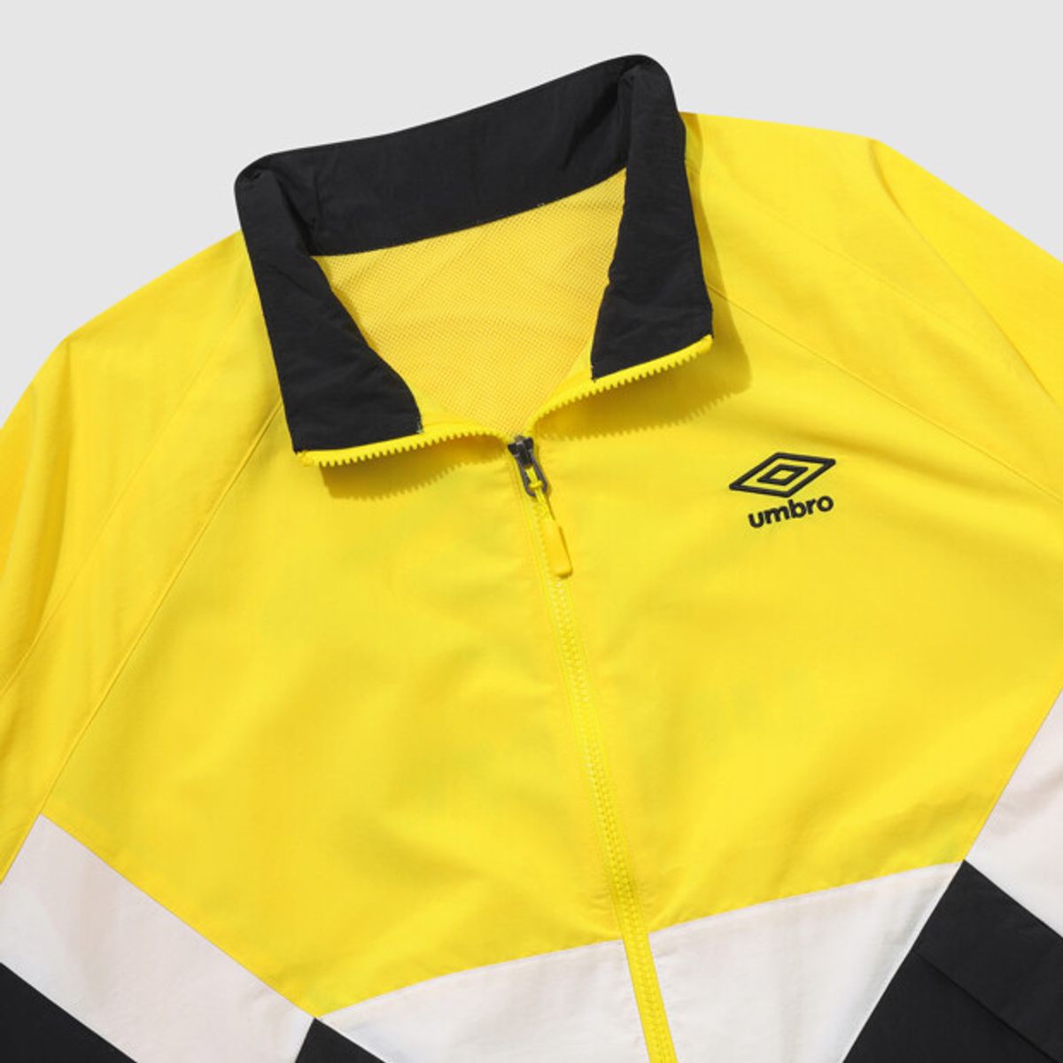 엄브로(UMBRO) 팝러쉬 컬러블럭 스탠넥 바람막이 자켓 옐로우 UR123CJK34