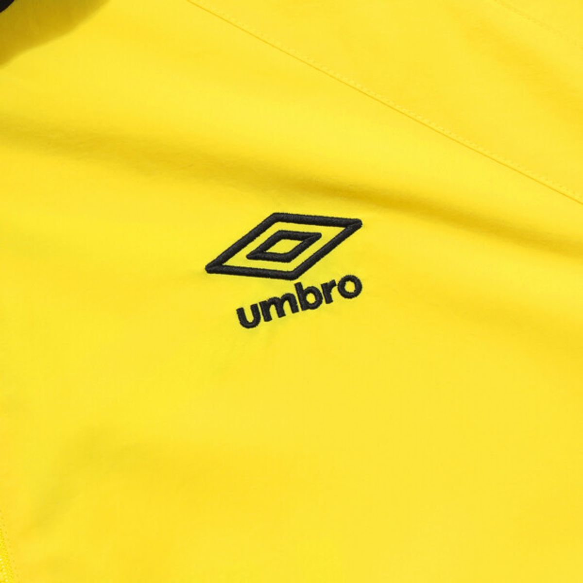 엄브로(UMBRO) 팝러쉬 컬러블럭 스탠넥 바람막이 자켓 옐로우 UR123CJK34