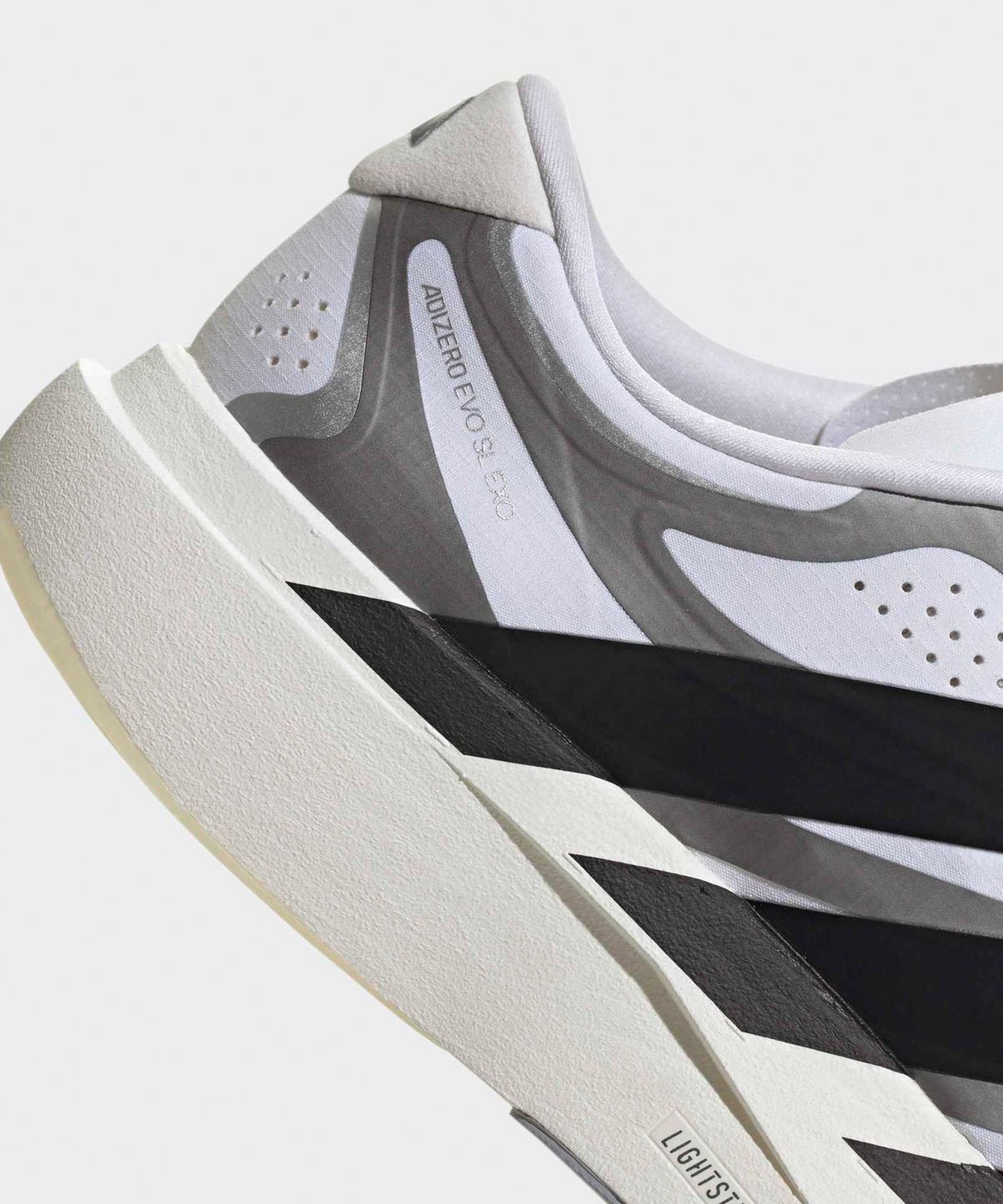 아디다스(ADIDAS) 아디제로 EVO SL EXO M - 화이트:블랙:아이언메탈릭 / KI4763