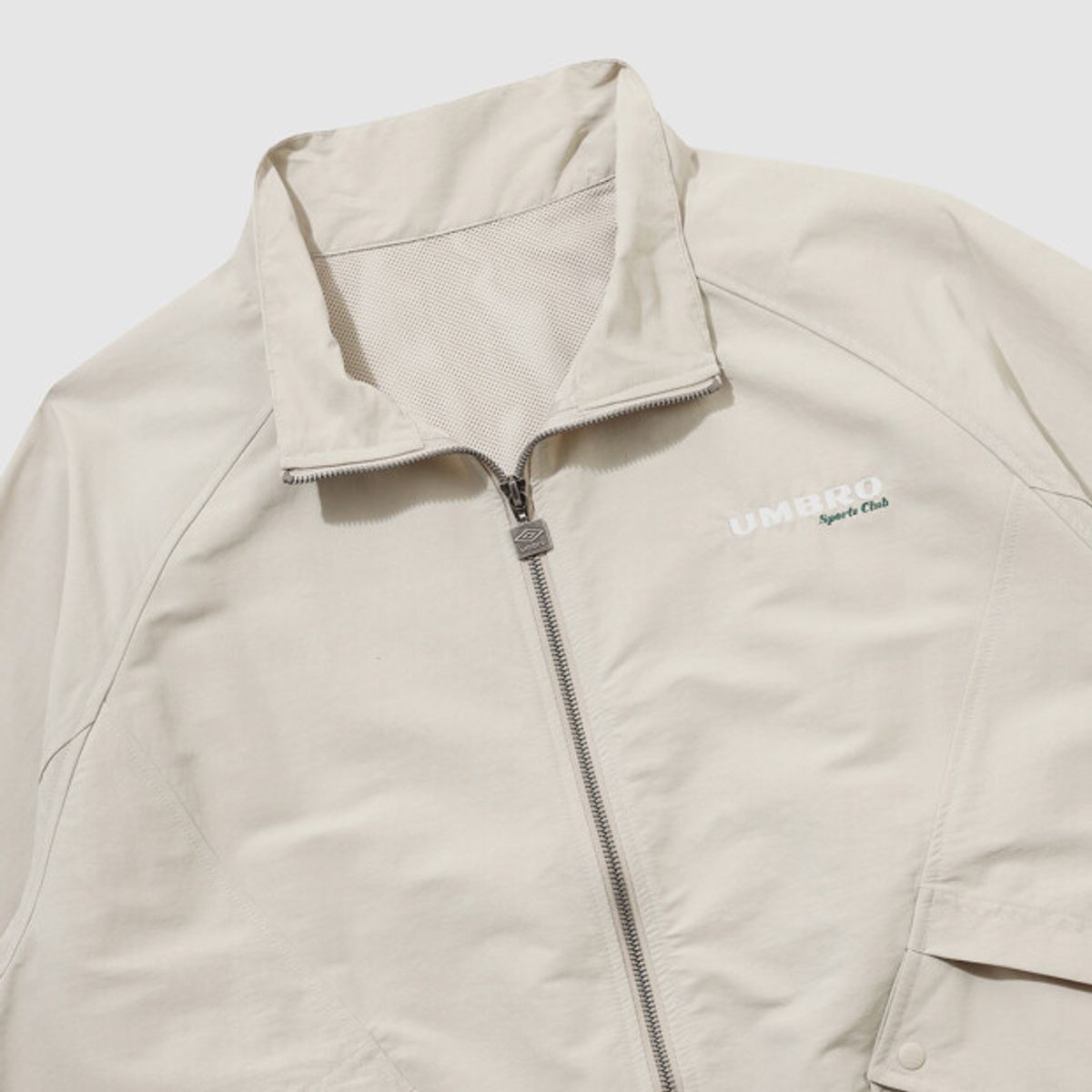 엄브로(UMBRO) 린넨라이크 스탠넥 블루종 바람막이 자켓 베이지 UR121CJK35