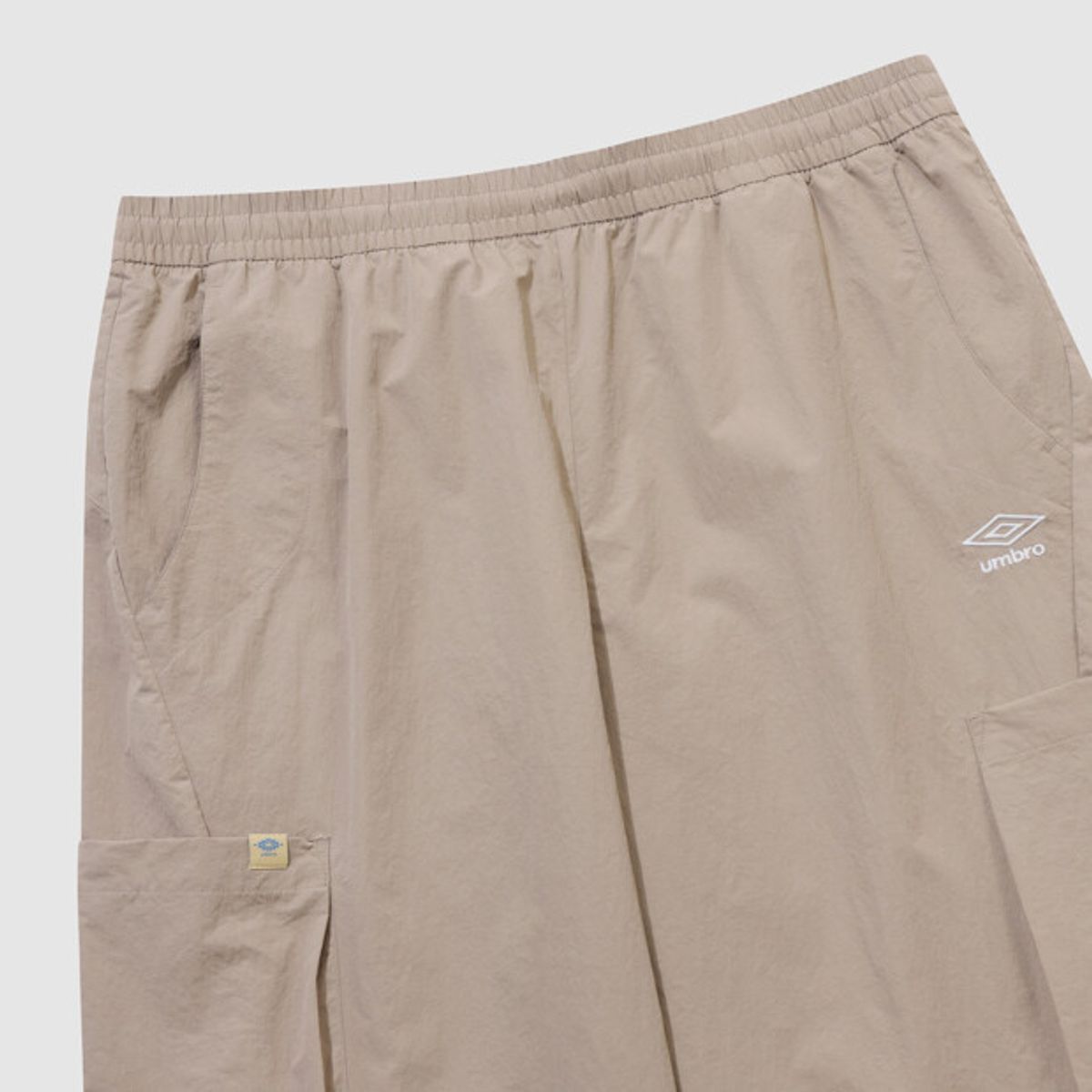 엄브로(UMBRO) 하이웨이 와이드 조거 2WAY 카고 팬츠 베이지 UR221CPT41