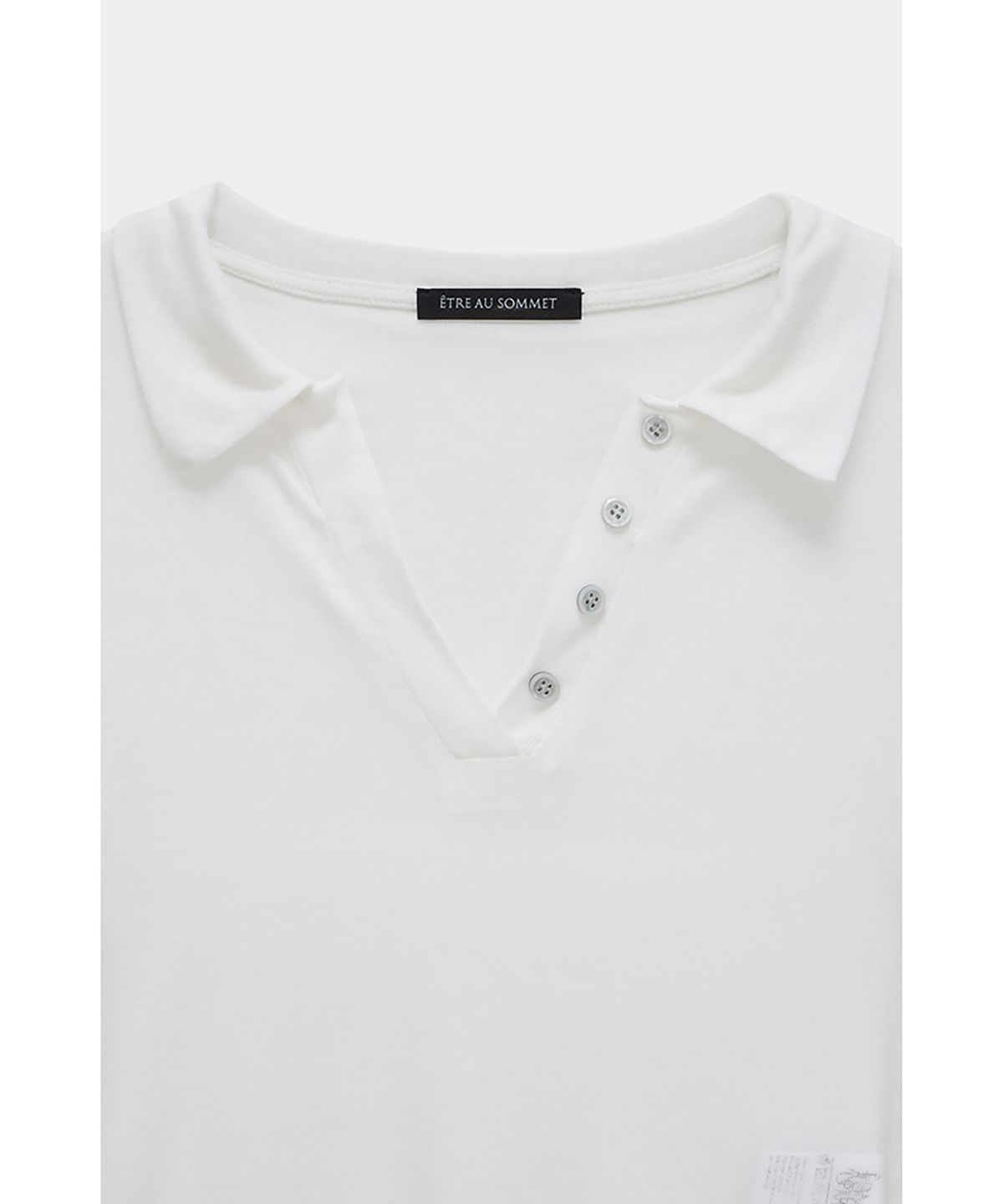 에트오소메(ETRE AU SOMMET) Rib Collar tattoo Long Sleeve Top (White)