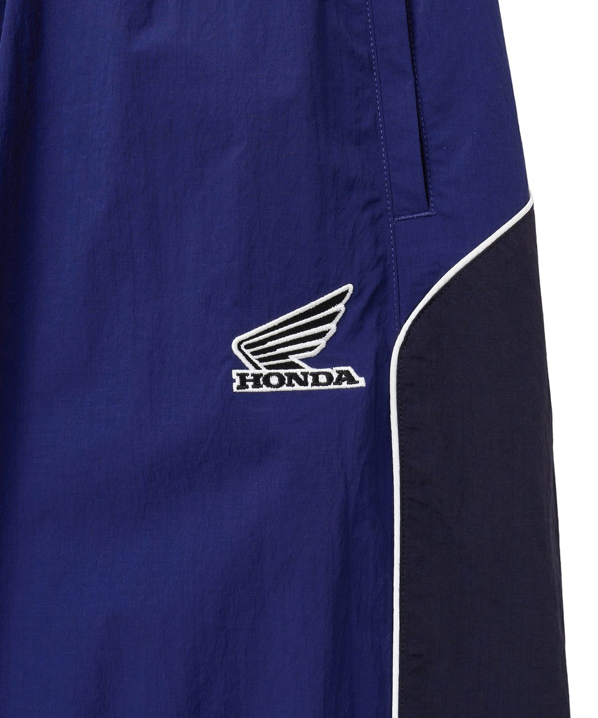 핍스 모터사이클(PHYPS MOTORCYCLE) Nylon Block Piping Track Pants Blue