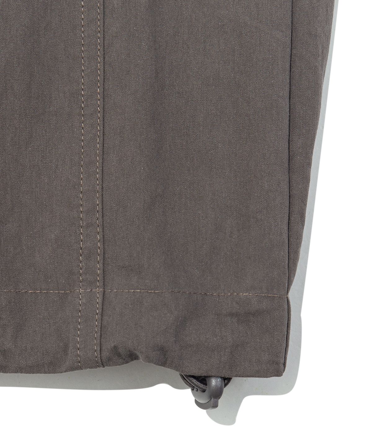더콜디스트모먼트(THE COLDEST MOMENT) TCM mini logo nylon pants (brown)