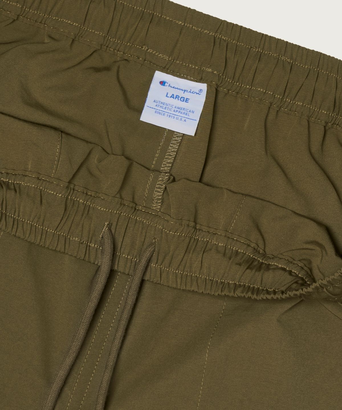 챔피온(CHAMPION) C로고 우븐 쇼츠 Khaki