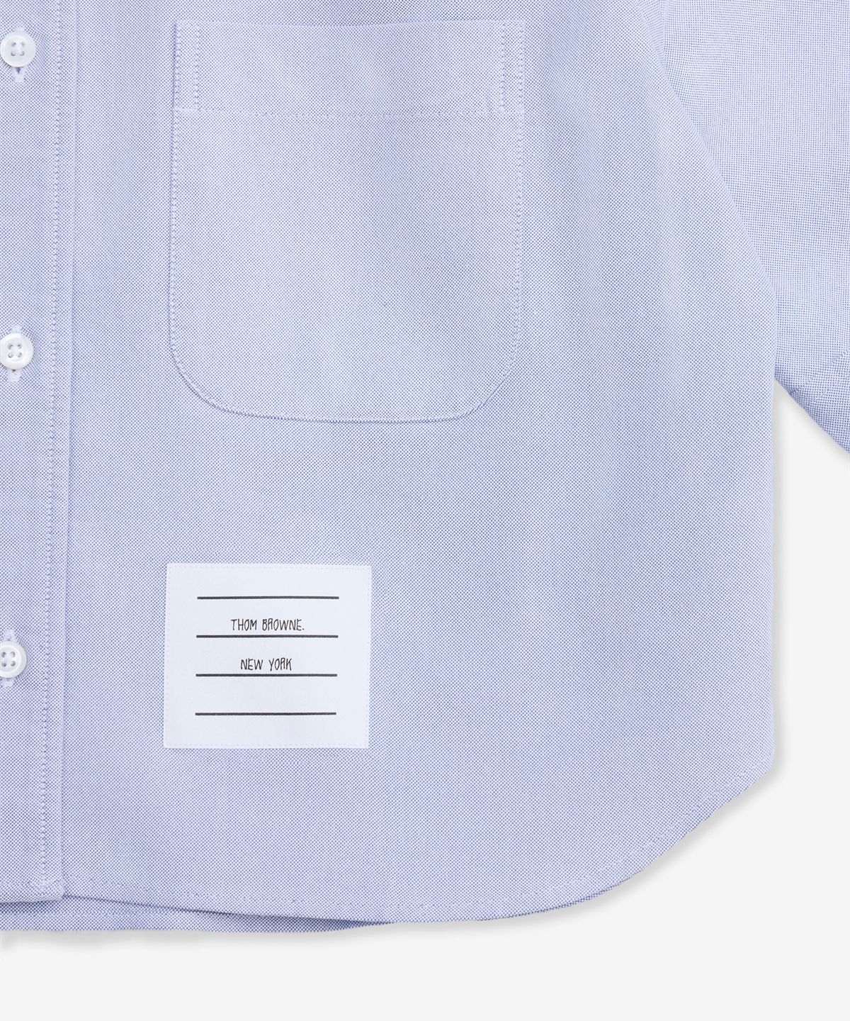 톰 브라운(THOM BROWNE) 옥스포드 크롭 숏 슬리브 셔츠 - 라이트 블루 / FLL205AF0313480