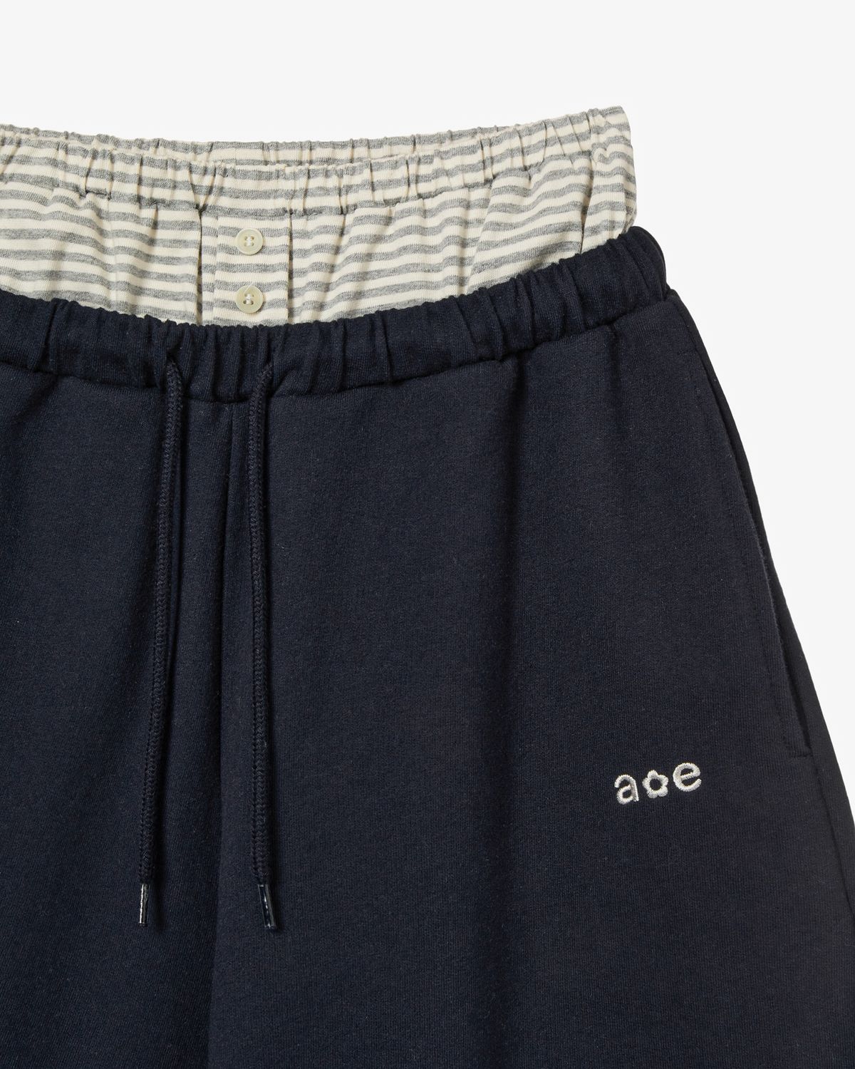 에이이에이이(AEAE) BRIEFS LAYERED SWEATPANTS [NAVY]