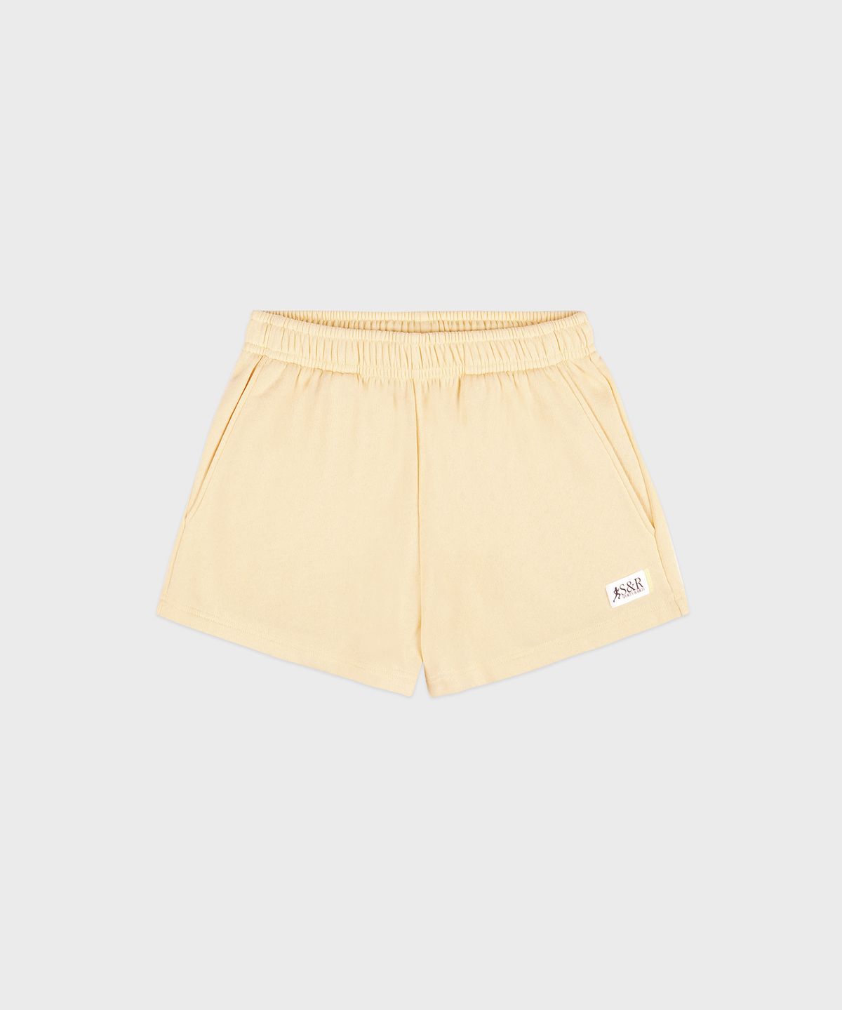 스포티앤리치(SPORTY&RICH) SR 러너 소프트 디스코 쇼츠 베이지 R255AW7023