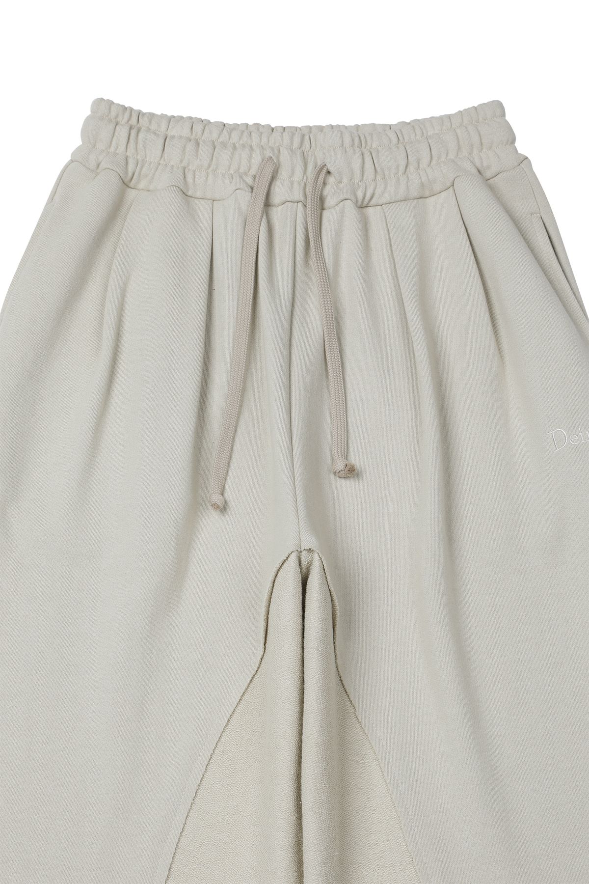 다이닛(DEINET) REVERSE CUT SWEATPANTS IN BEIGE