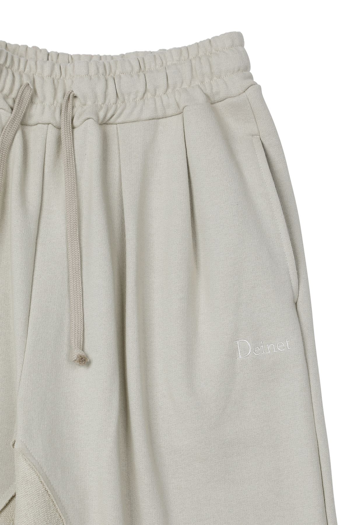 다이닛(DEINET) REVERSE CUT SWEATPANTS IN BEIGE