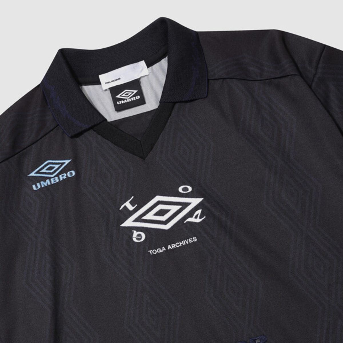 엄브로(UMBRO) [UMB X TOGA] 반팔 게임셔츠 원피스 블랙 UR112OOP21