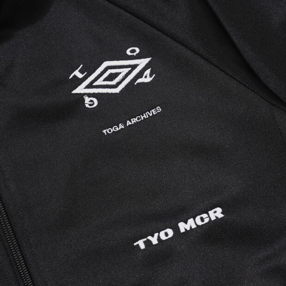 엄브로(UMBRO) [UMB X TOGA] 트랙 자켓 블랙 UR111OFT21