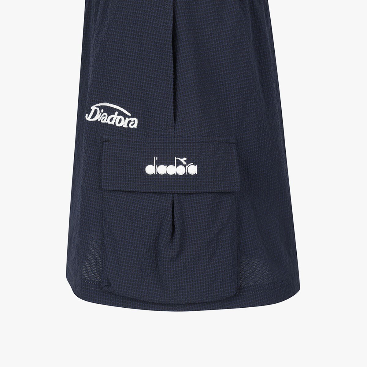 디아도라(diadora) 에어서커 카고 스커트 NAVY