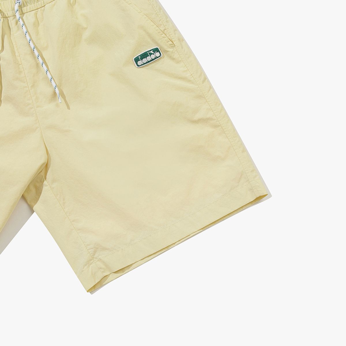 디아도라(diadora) 컴피 4부 우븐 쇼츠 YELLOW