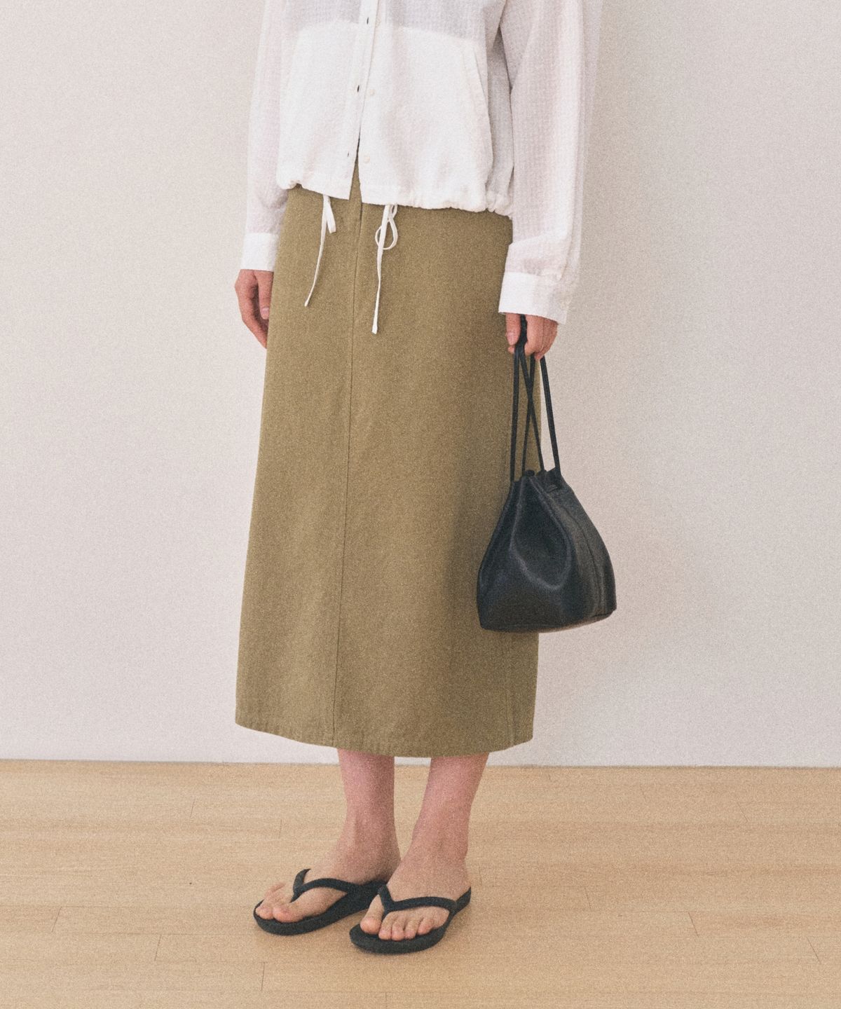 망고매니플리즈(MANGO MANY PLEASE) HEM WASHED SKIRT_KHAKI