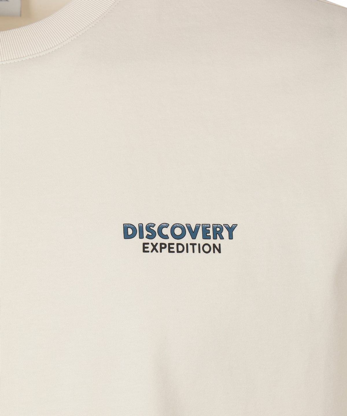 디스커버리 익스페디션(DISCOVERY EXPEDITION) 유니 프레시벤트 캐리어 그래픽 반팔티셔츠 (D/IVORY)