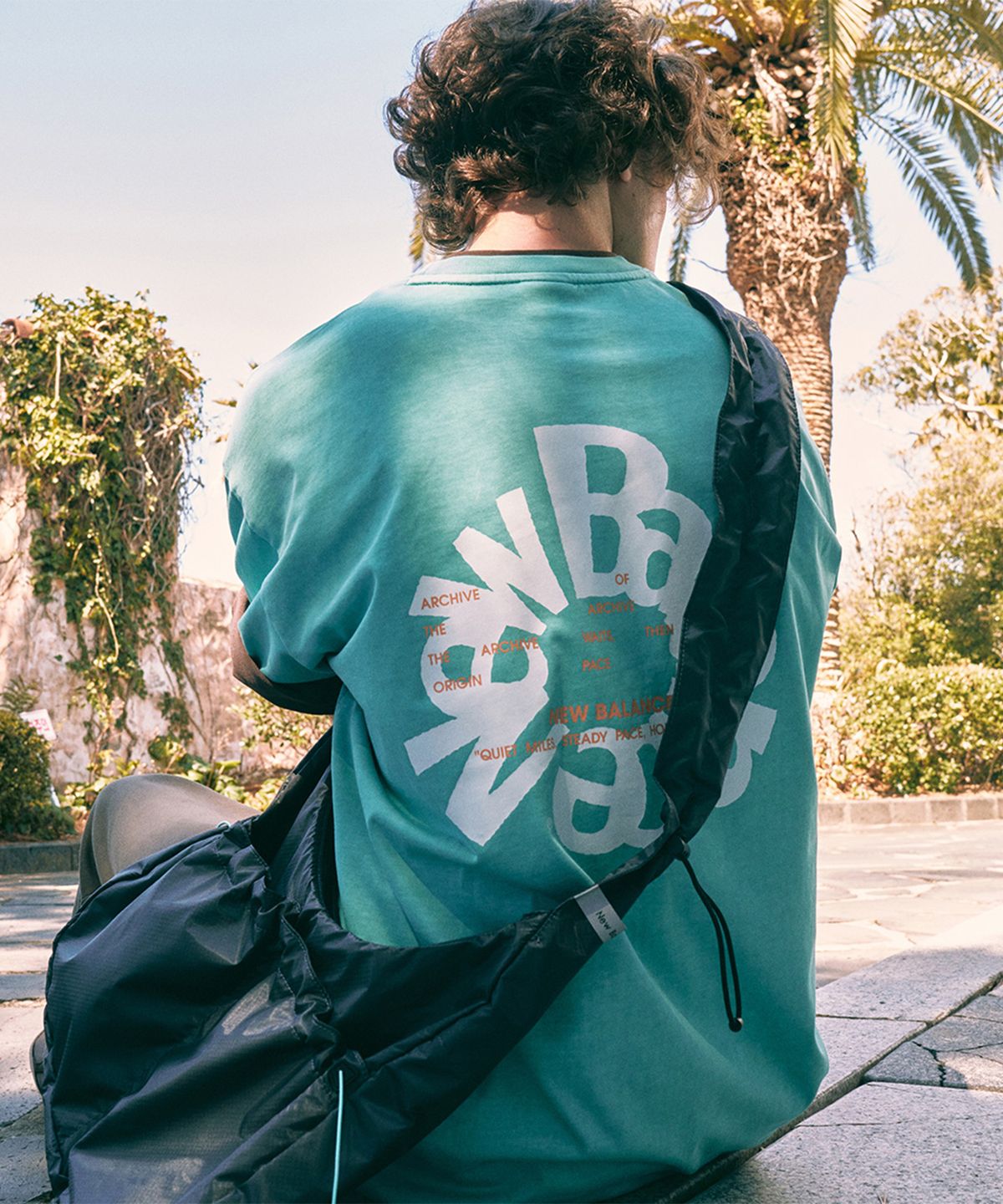 뉴발란스(NEW BALANCE) NBNEG2A083 / UNI Archive Pace Circle 반팔티 (TURQUOISE)