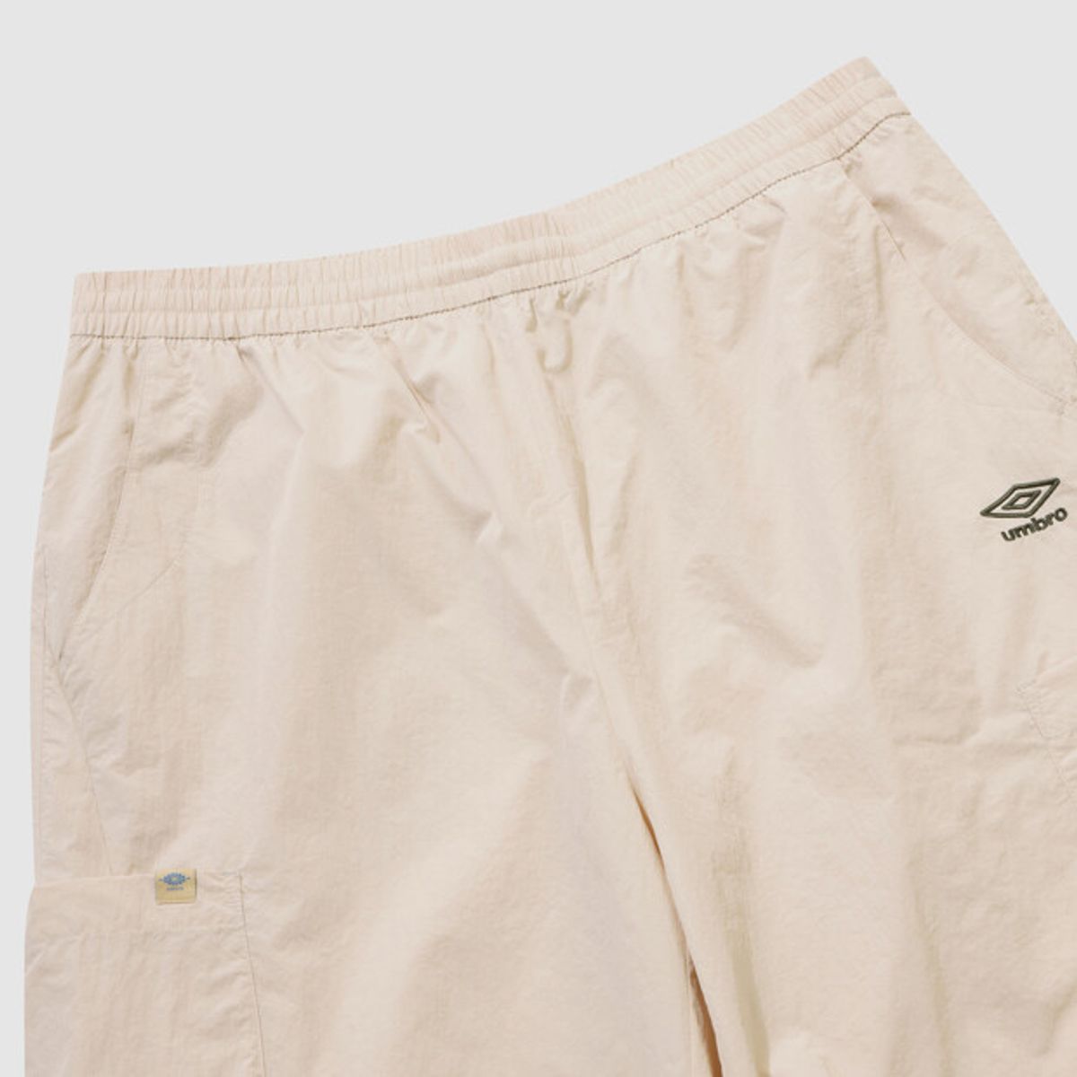 엄브로(UMBRO) 하이웨이 5.5부 카고 반바지 아이보리 UR223CHP41