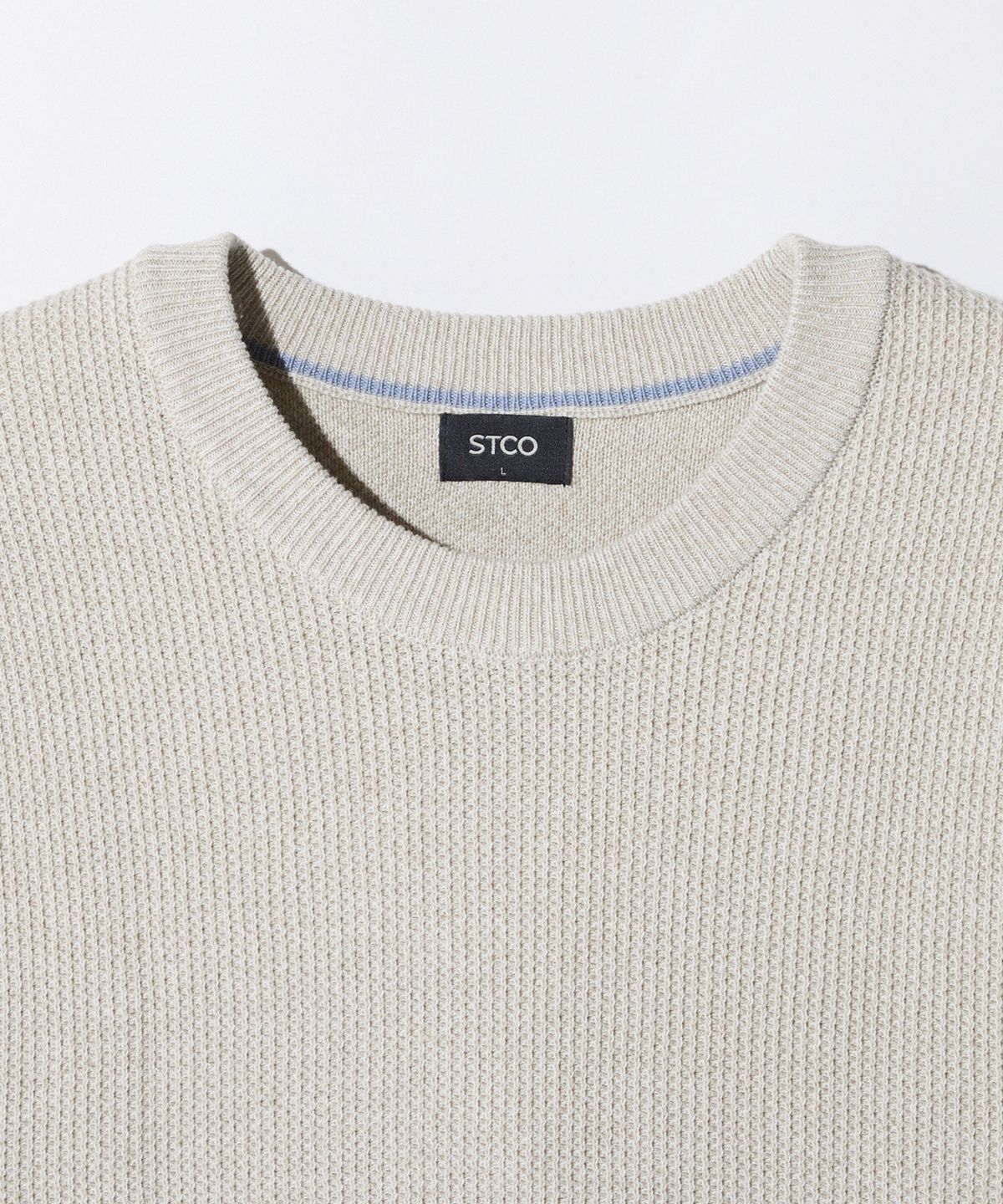 에스티코(STCO) 라운드 투톤 변형 조직 니트_베이지 (세미오버핏)_SKTXA01NSD