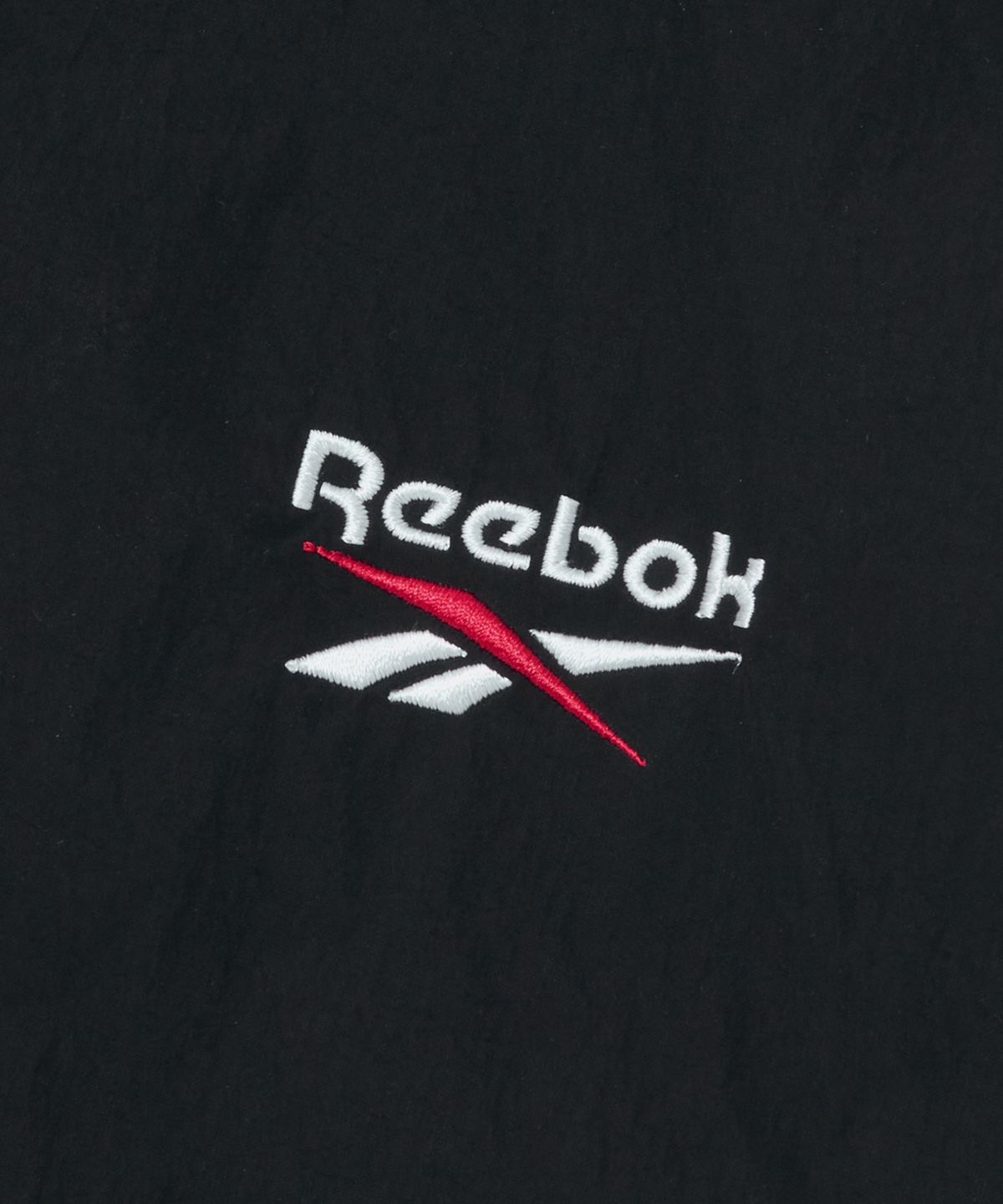 리복(REEBOK) 일립스 크롭 윈드브레이커 v26 (W) - 블랙