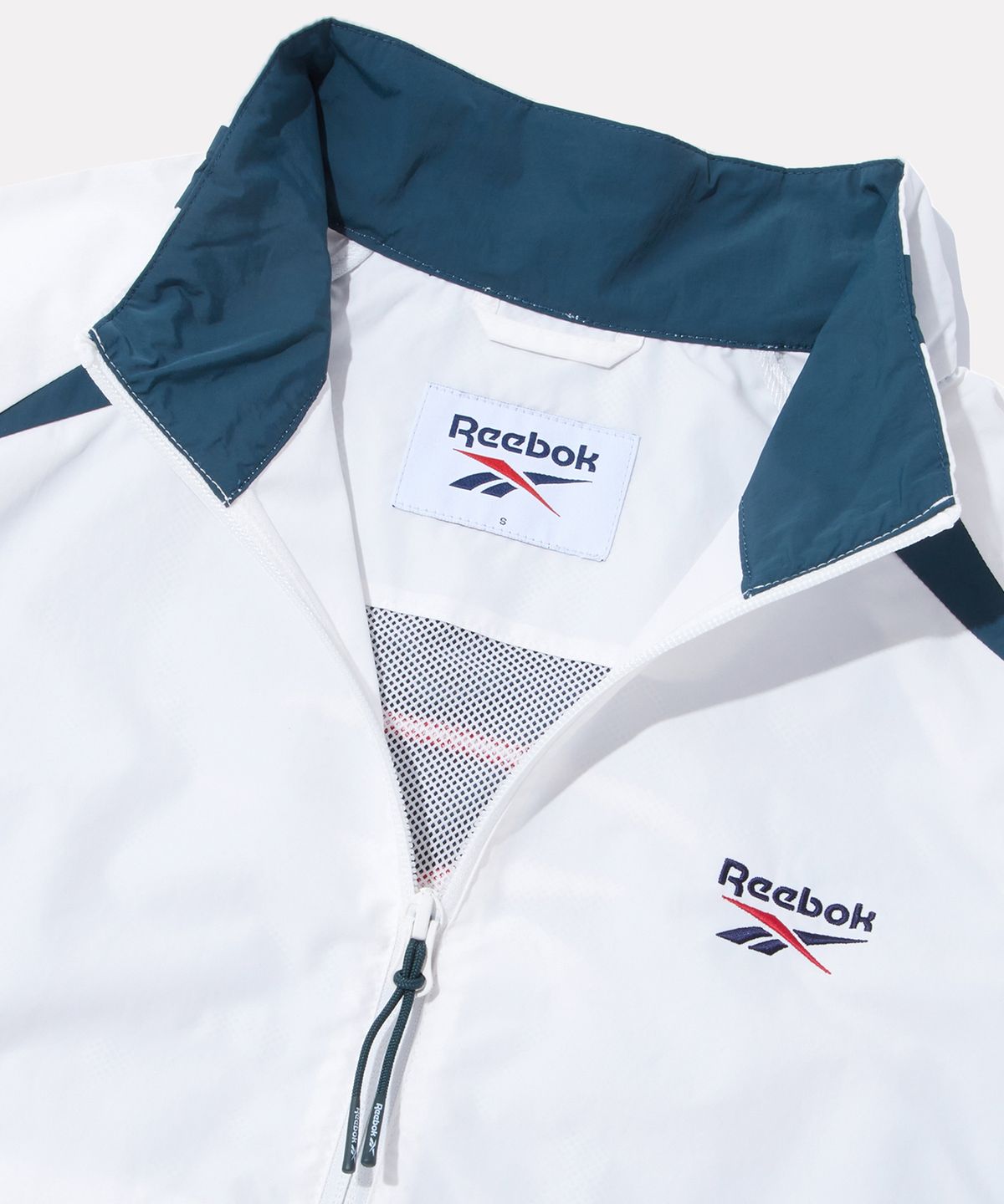 리복(REEBOK) 일립스 크롭 윈드브레이커 v26 (W) - 아이보리:틸 그린