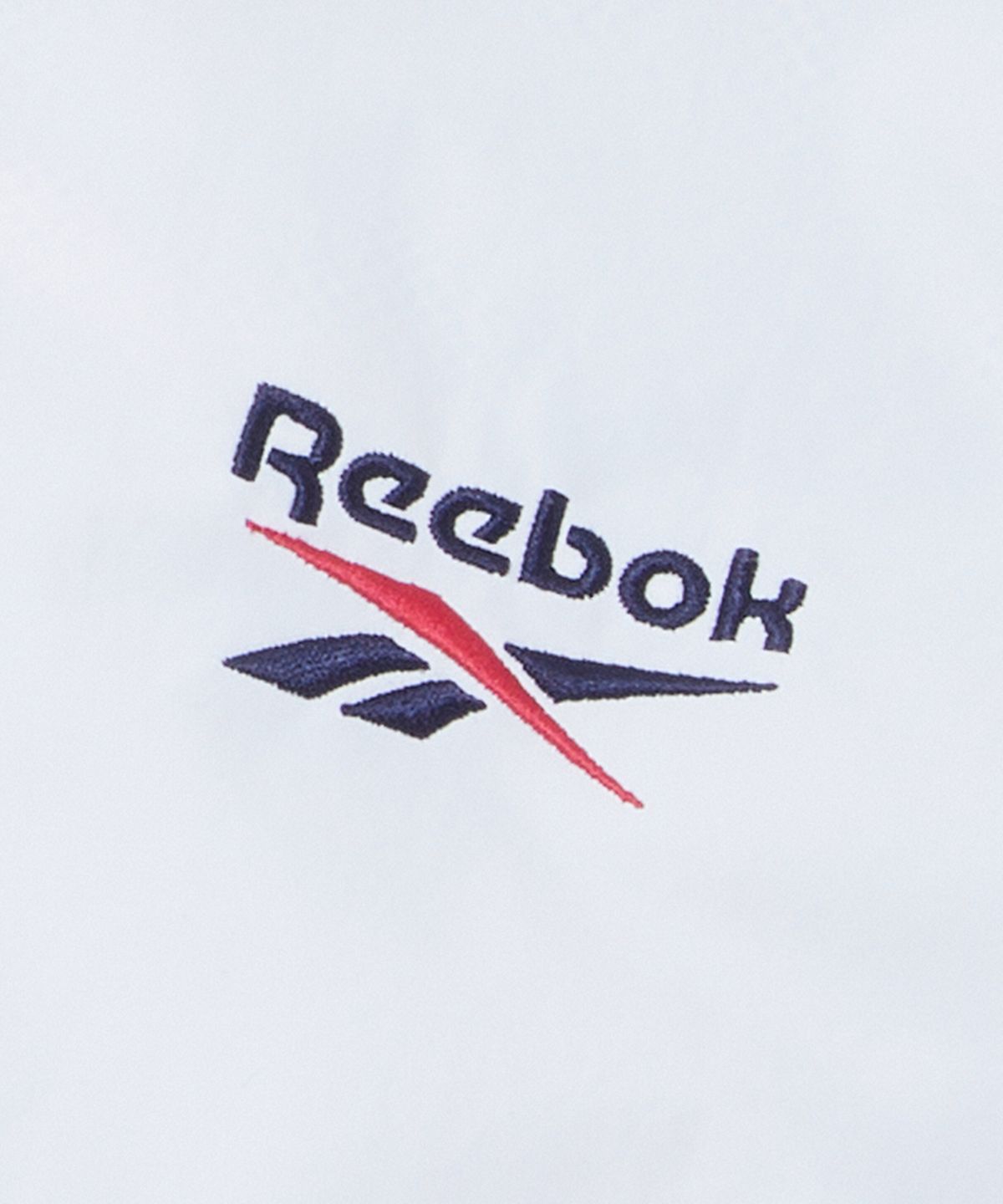 리복(REEBOK) 일립스 크롭 윈드브레이커 v26 (W) - 아이보리:틸 그린
