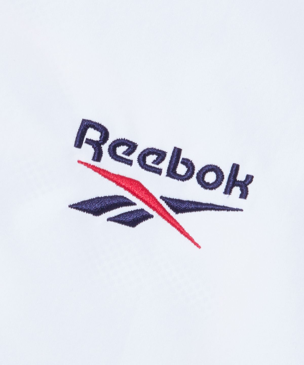 리복(REEBOK) 일립스 크롭 윈드브레이커 v26 (W) - 화이트:네이비