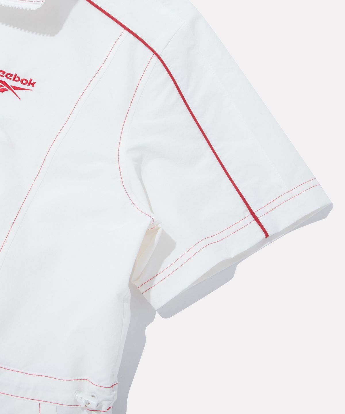 리복(REEBOK) 스티치 파이핑 아노락 원피스 (W) - 오프 화이트