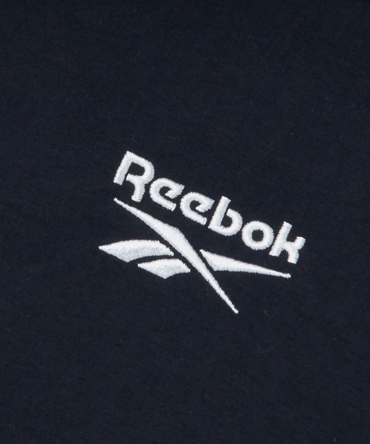 리복(REEBOK) 스티치 파이핑 아노락 원피스 (W) - 블랙