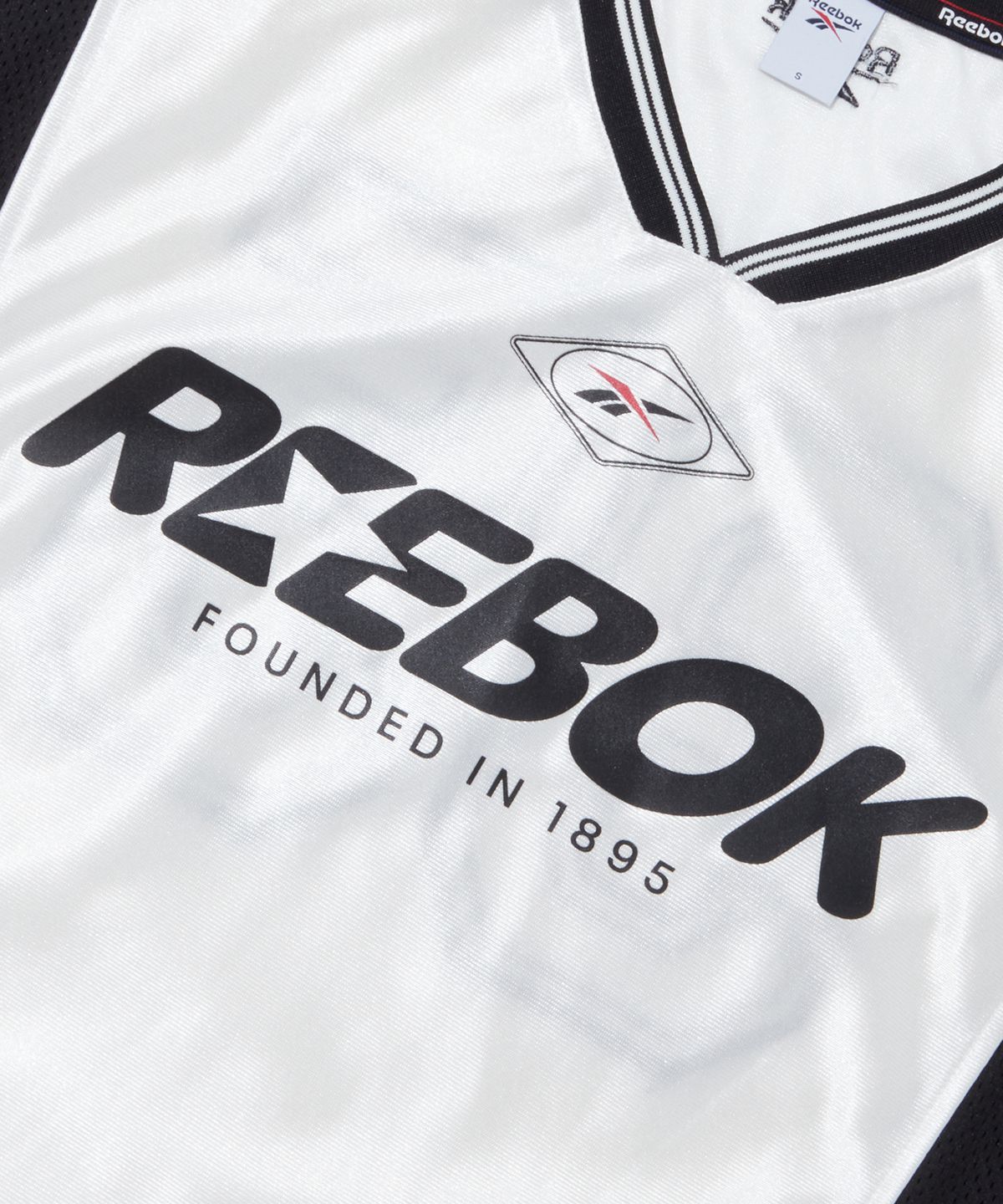 리복(REEBOK) 스포츠 저지 새틴 반팔티 (W) - 화이트