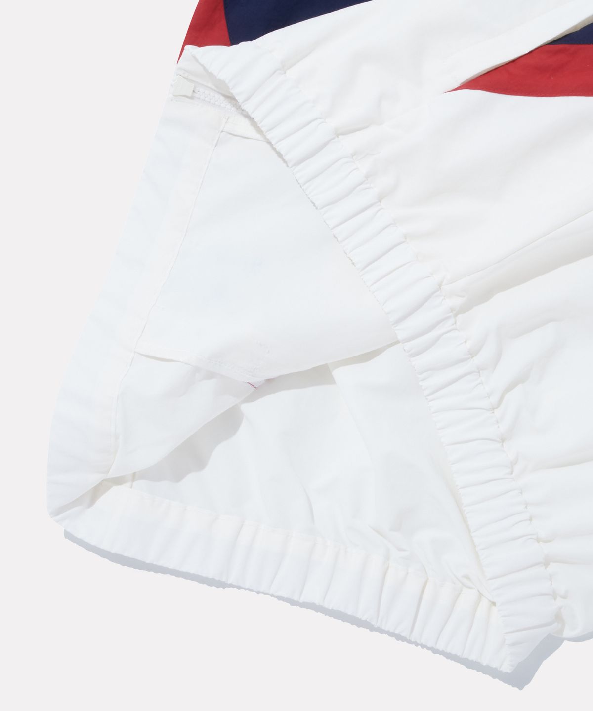 리복(REEBOK) DNA 컬러블록 윈드브레이커 - 오프 화이트