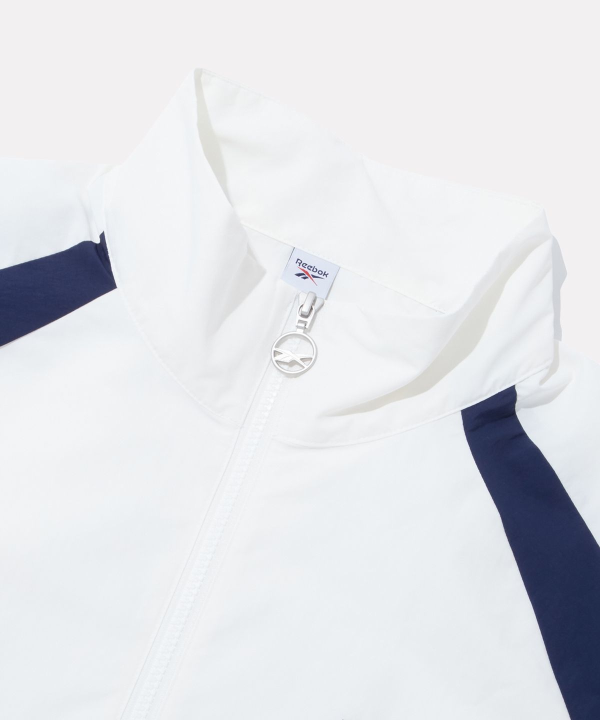 리복(REEBOK) DNA 컬러블록 반팔 아노락 - 화이트:네이비
