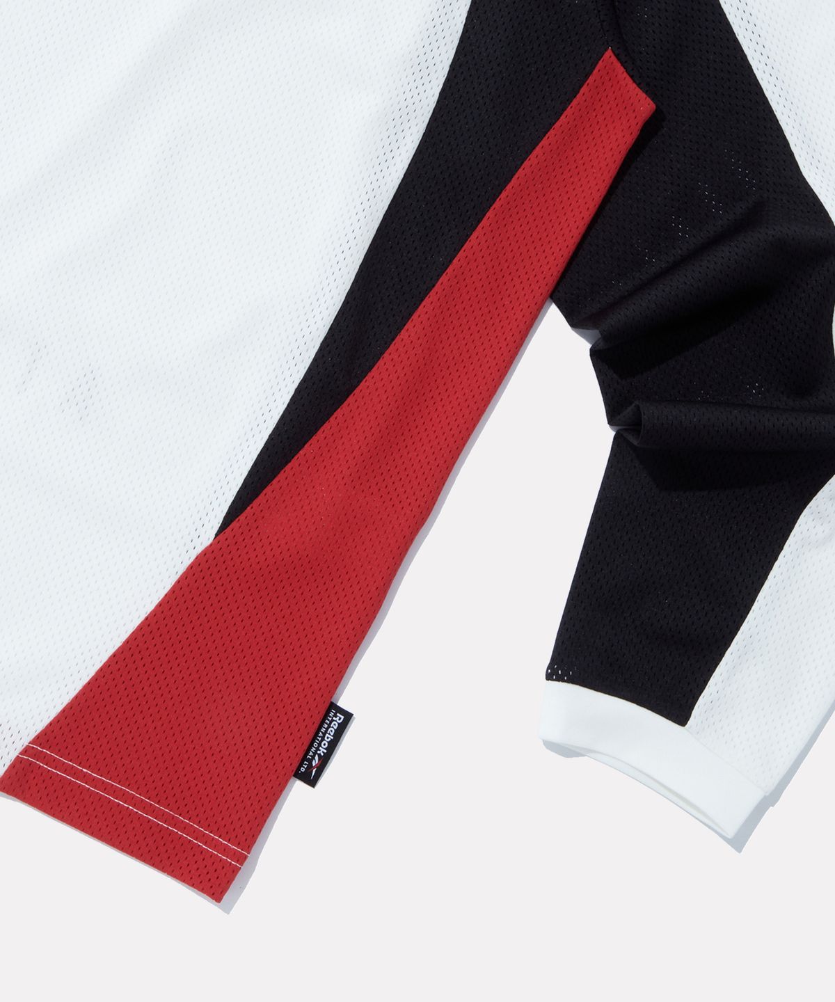 리복(REEBOK) 스포츠 저지 메쉬 긴팔티 - 오프 화이트