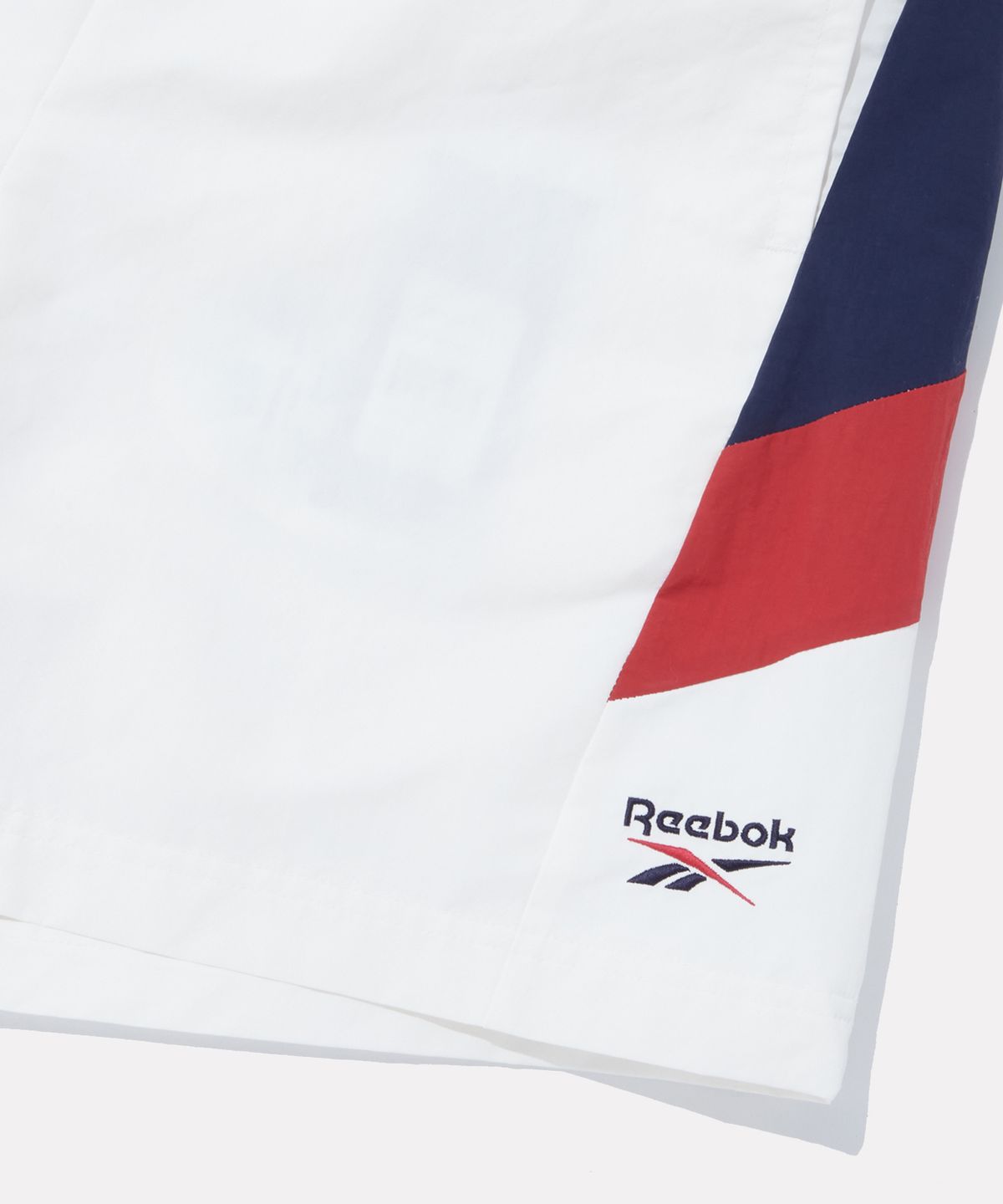 리복(REEBOK) DNA 컬러블록 쇼츠 - 화이트:네이비