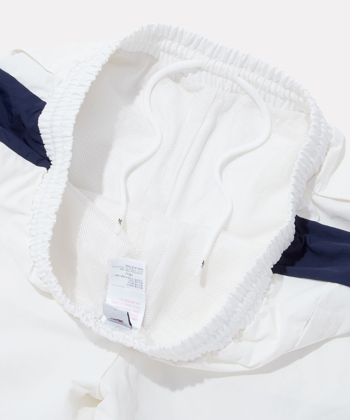 리복(REEBOK) DNA 컬러블록 쇼츠 - 화이트:네이비
