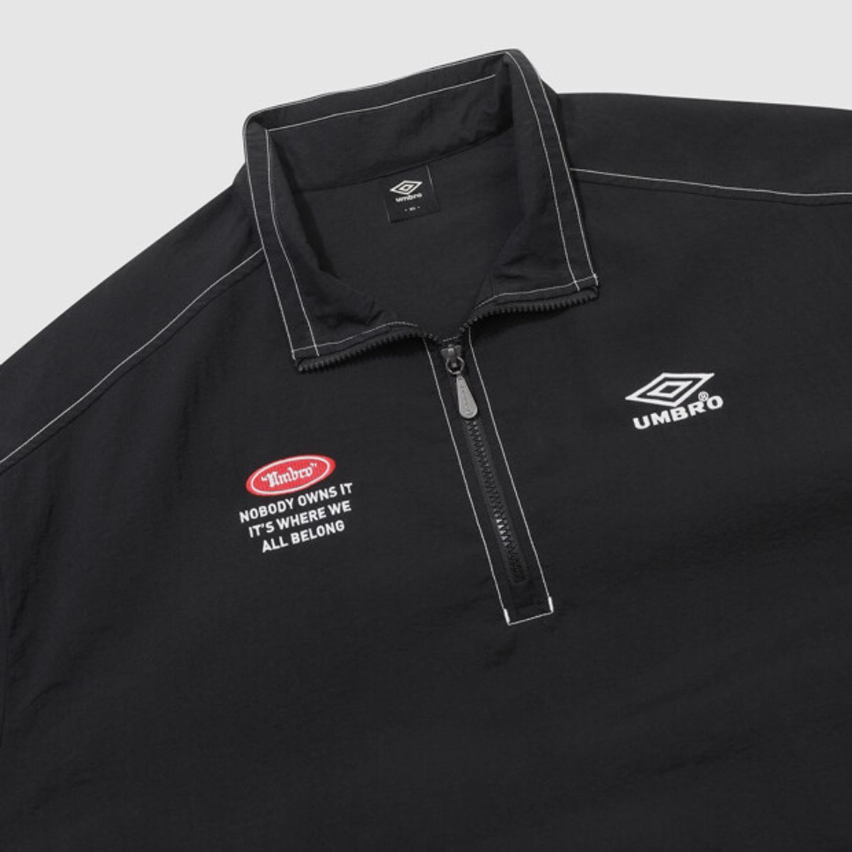 엄브로(UMBRO) 크리스피 타슬란 반팔 아노락 블랙 UR224CWT59