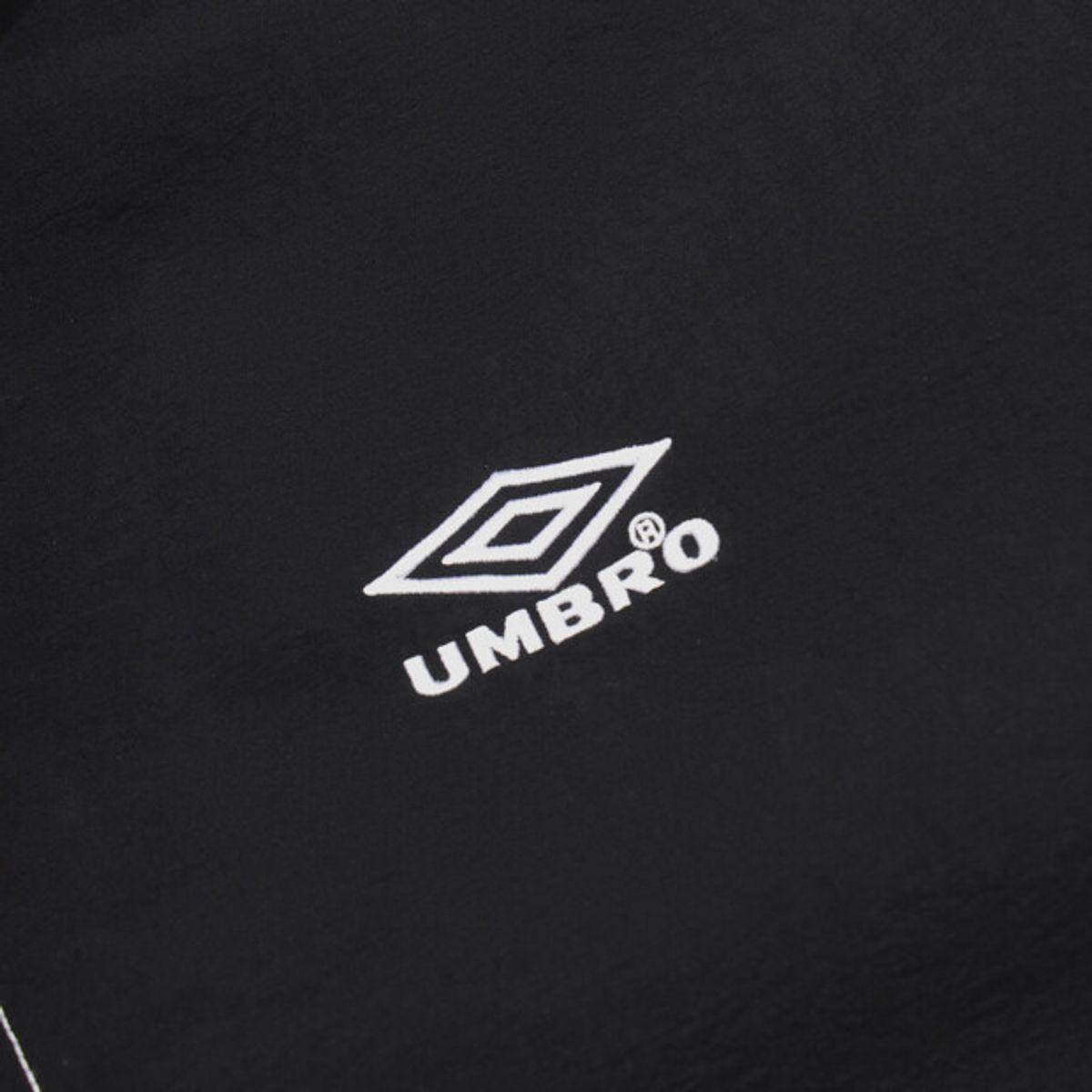 엄브로(UMBRO) 크리스피 타슬란 반팔 아노락 블랙 UR224CWT59