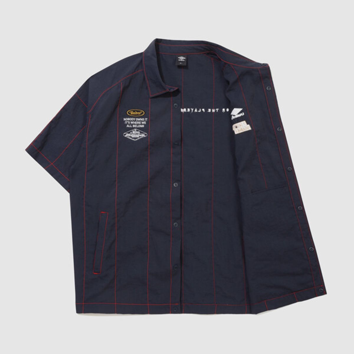 엄브로(UMBRO) 크리스피 타슬란 반팔 셔츠 네이비 UR221CJK58